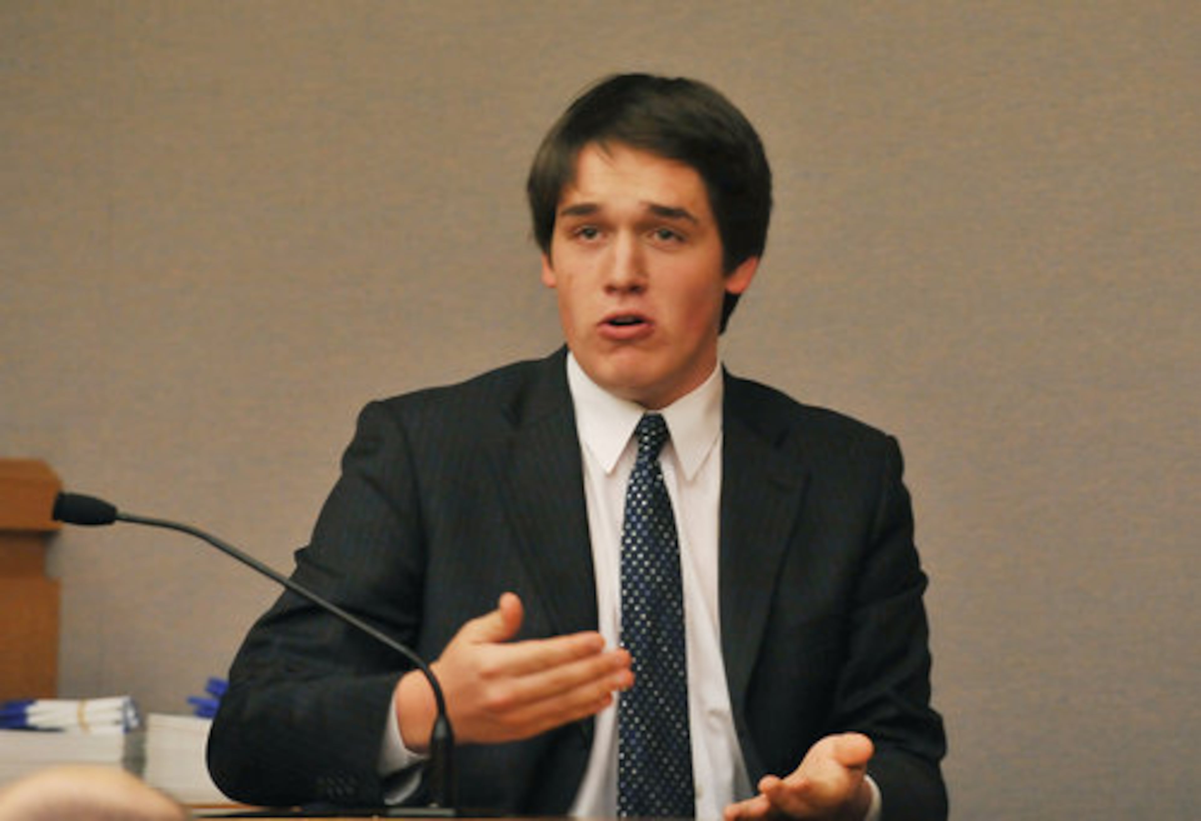 Grady High School's Gus Rick, 17, portrays Alex Sadler on the witness stand. Grady High, (the plantiffs) argued a mock civil case against Central High School of Macon.