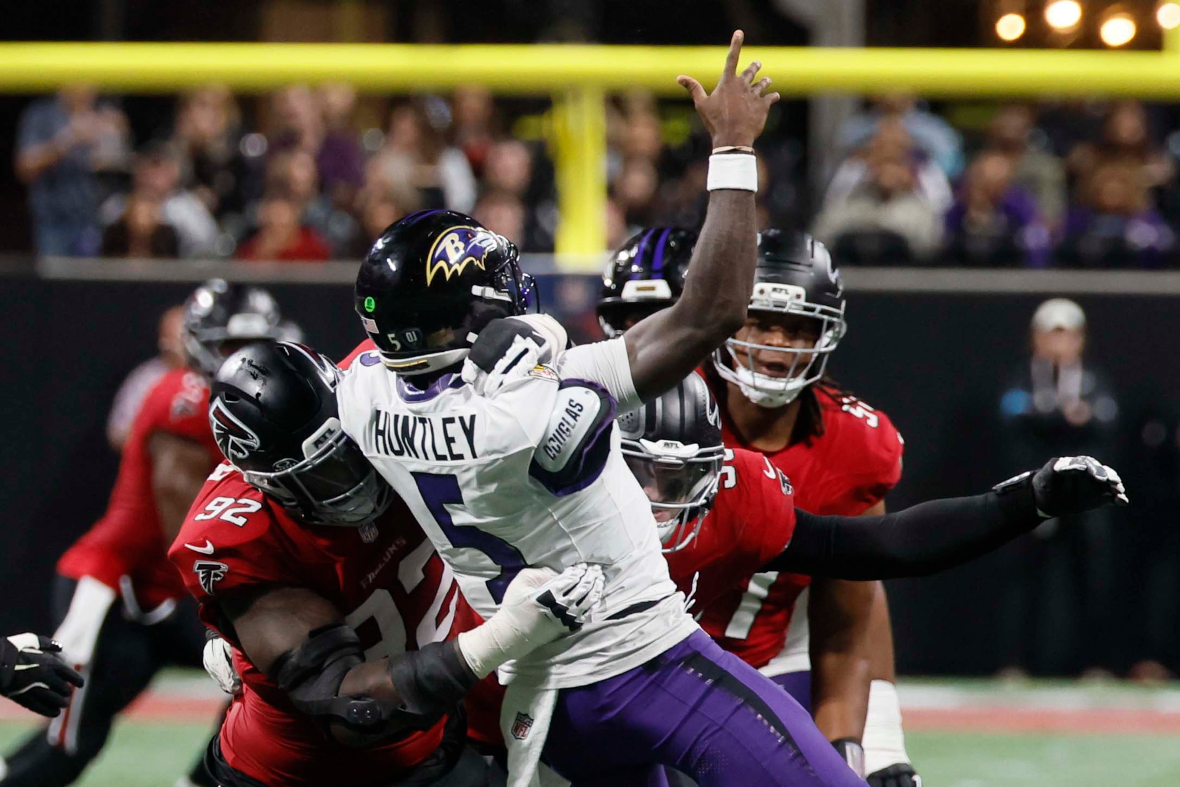 Atlanta Falcons defensive tackle Maason Smith (92) tackles Baltimore Ravens quarterback Tyler Huntley (5) during the second half of a football game against the Ravens at Mercedes-Benz Stadium in Atlanta, GA, Sunday, Oct. 11, 2026. (Miguel Martinez/AJC)