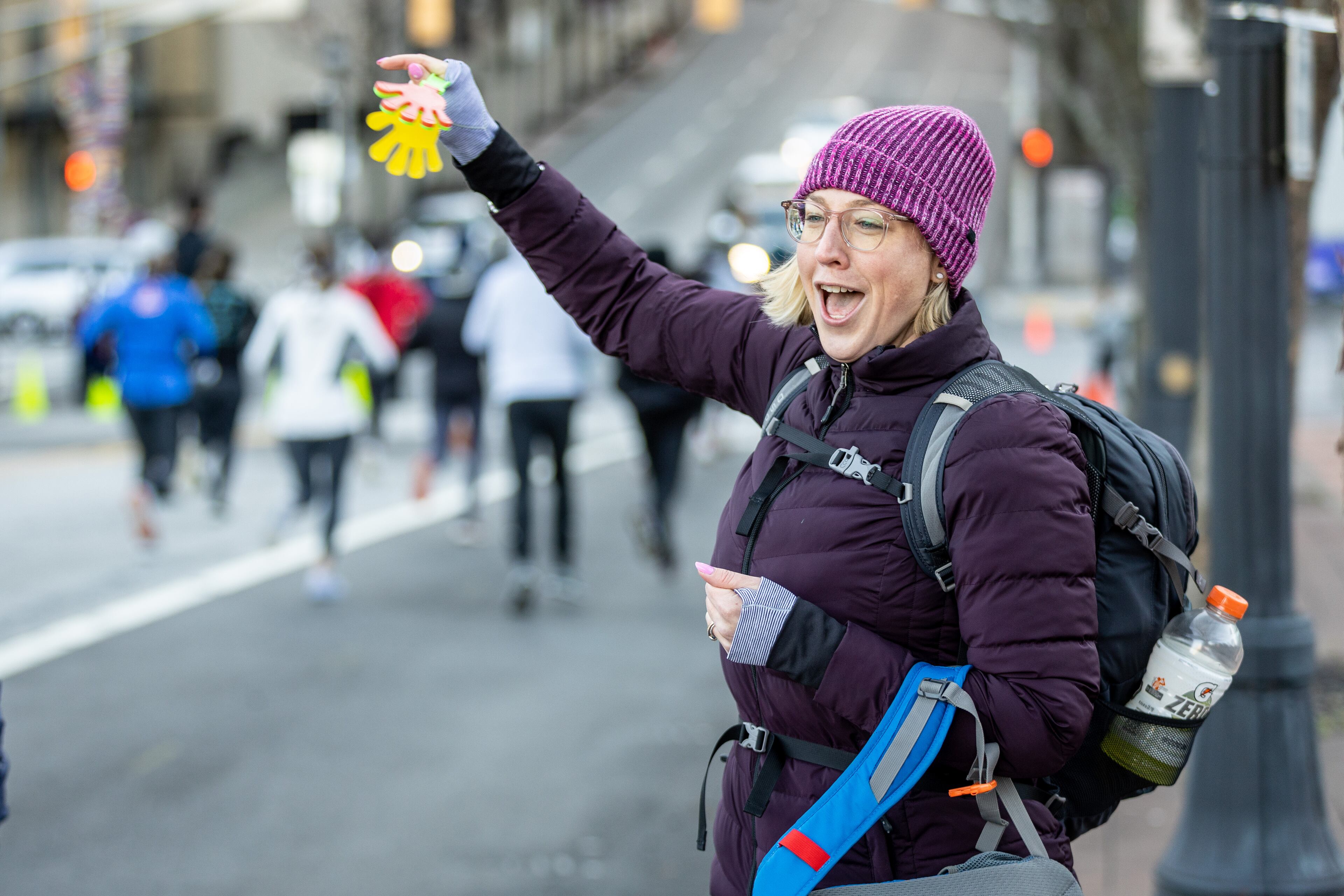 Christina Cooper Nowicki cheers on the runners at the start of the 20th annual Atlanta Mission 5K Race to End Homelessness on Saturday morning, Feb. 18, 2023. (Photo: Steve Schaefer / steve.schaefer@ajc.com)