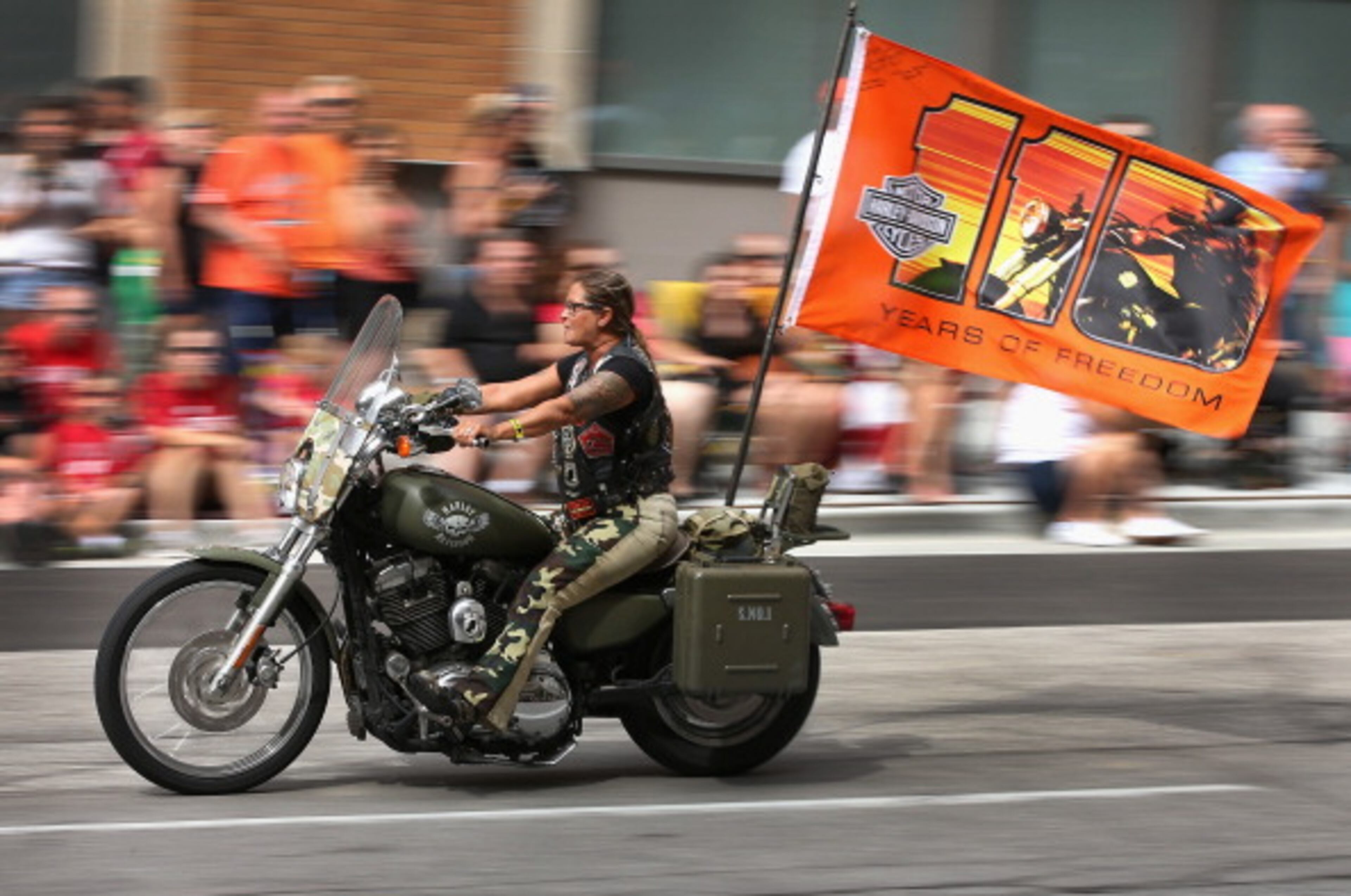 MILWAUKEE, WI - AUGUST 31: Motorcycle enthusiasts ride their bikes in a parade through downtown to celebrate Harley-Davidson's 110th anniversary on August 31, 2013 in Milwaukee, Wisconsin. More than 100,000 people from around the world are expected to visit Milwaukee over the weekend to celebrate the anniversary. (Photo by Scott Olson/Getty Images)