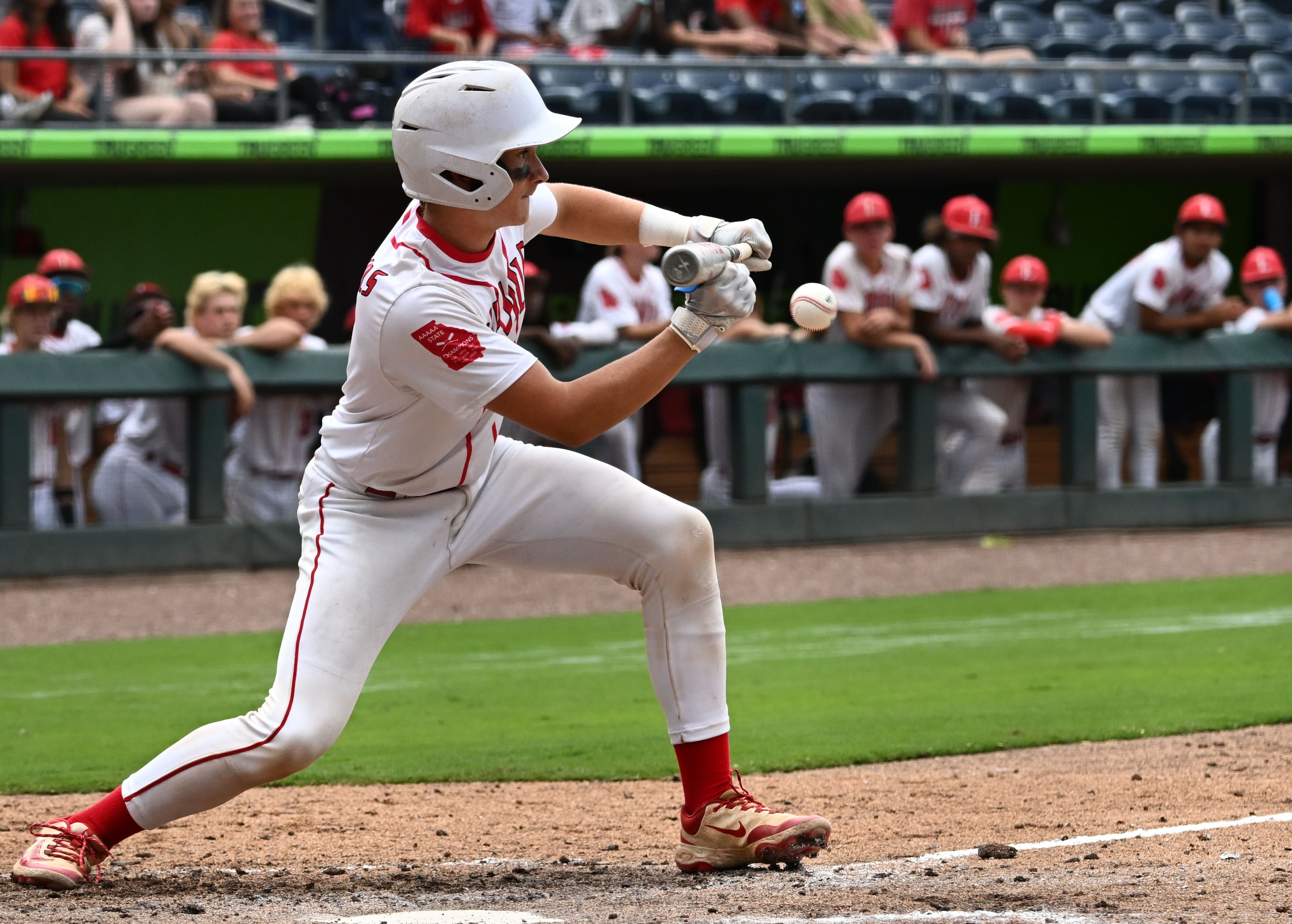 Loganville's Dawson Allen tries to bunt during the fifth inning of Game 1 of the GHSA Class 5A baseball state championship series Monday, May 25, 2026, at Gwinnett Field in Lawrenceville. (Hyosub Shin/AJC)