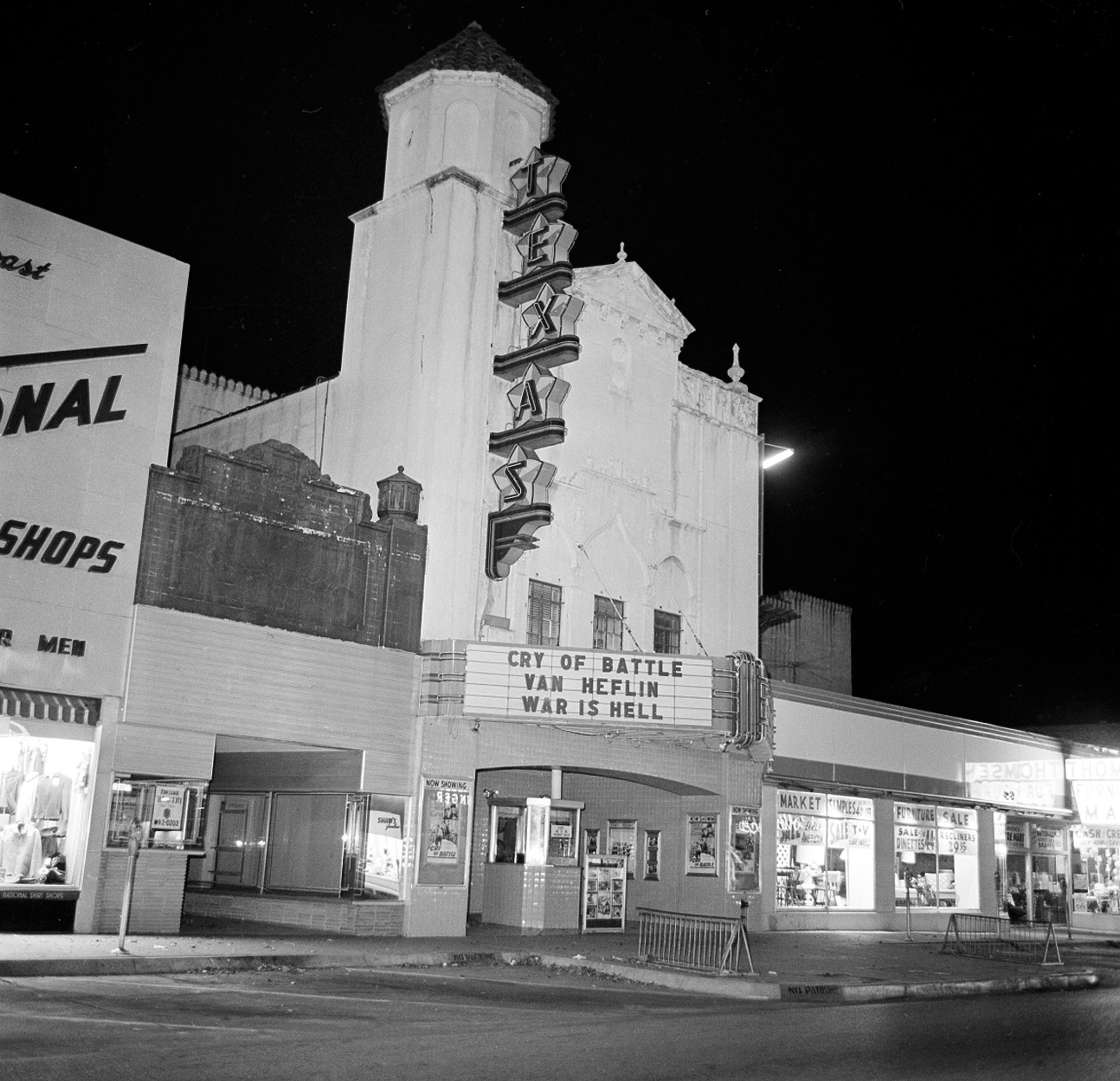 This Nov. 22, 1963 file photo shows the movie theater where Lee Harvey Oswald was arrested after U.S. President John F. Kennedy was shot and killed in Dallas. The Warren Commission said Oswald left the book depository moments after shots were fired from the sixth floor, returned by bus and cab to his rooming house, then ventured out again _ soon encountering a Dallas police officer who stopped him based on descriptions of the assassination suspect. According to the commission, Oswald fatally shot Patrolman J.D. Tippit with a handgun, then fled into the nearby movie theater. (AP Photo)