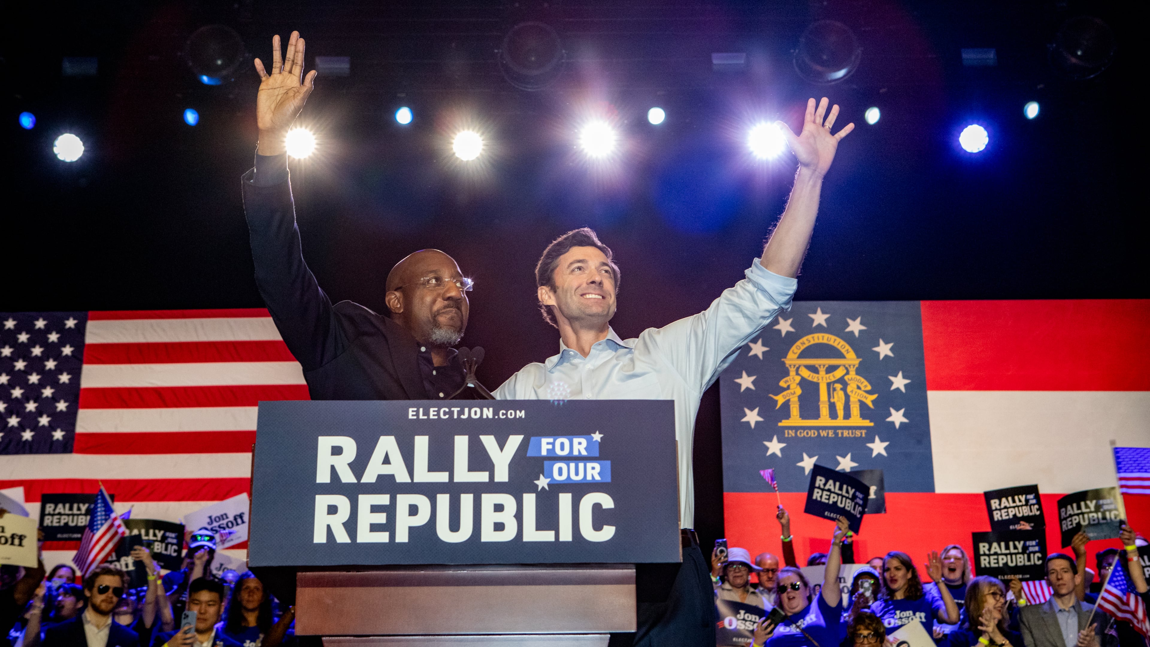 U.S. Sen. Raphael Warnock, left, introduces U.S. Sen. Jon Ossoff, right, to the stage during a “Rally for the Republic” at The Eastern on Saturday, March 22, 2025. Both senators are Georgia Democrats. (Jenni Girtman for The Atlanta Journal-Constitution)