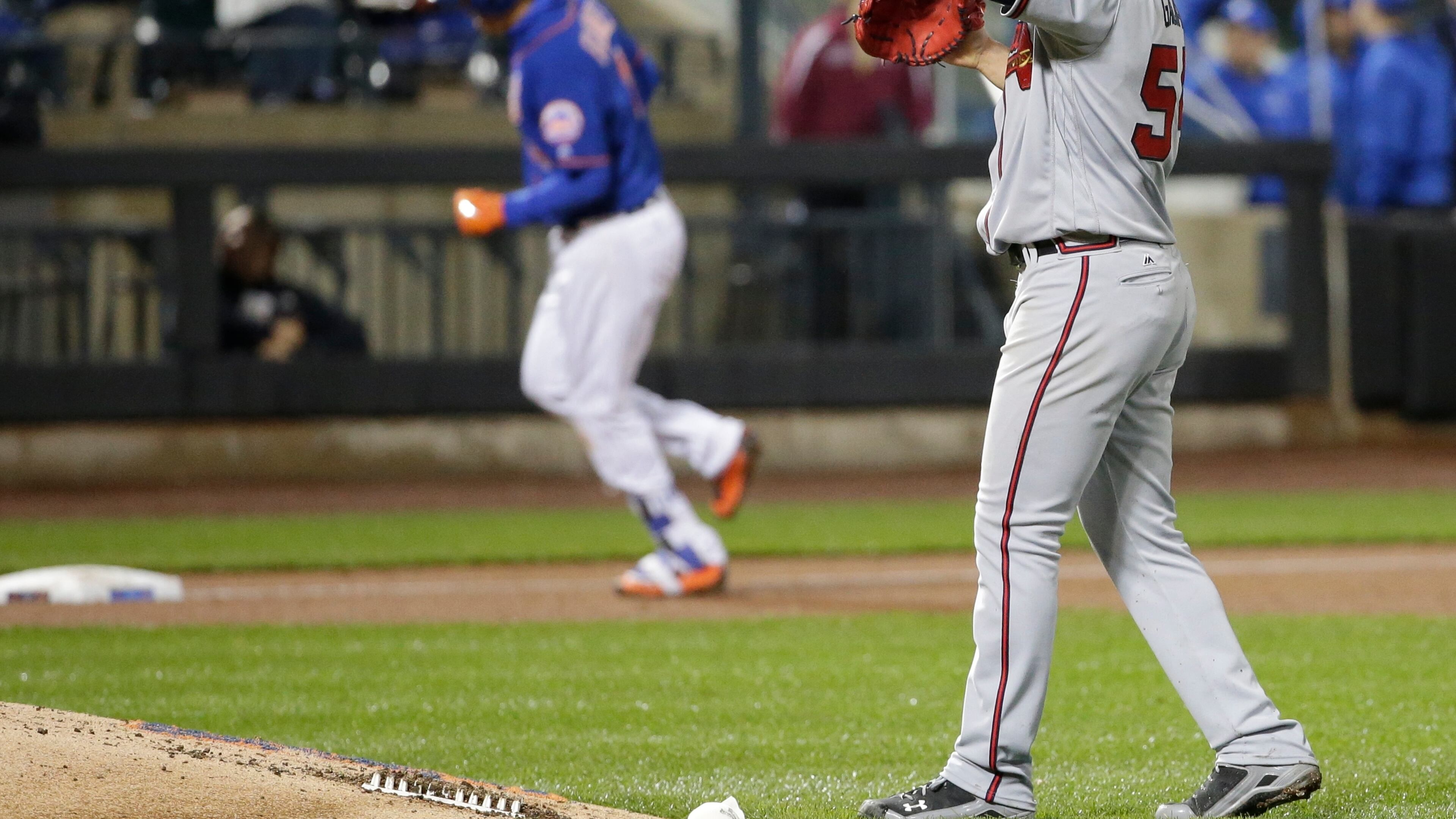 Braves pitcher Jaime Garcia reacts as New York Mets’ Wilmer Flores runs the bases after hitting a two-run home run during the sixth inning Thursday. (AP Photo/Frank Franklin II)