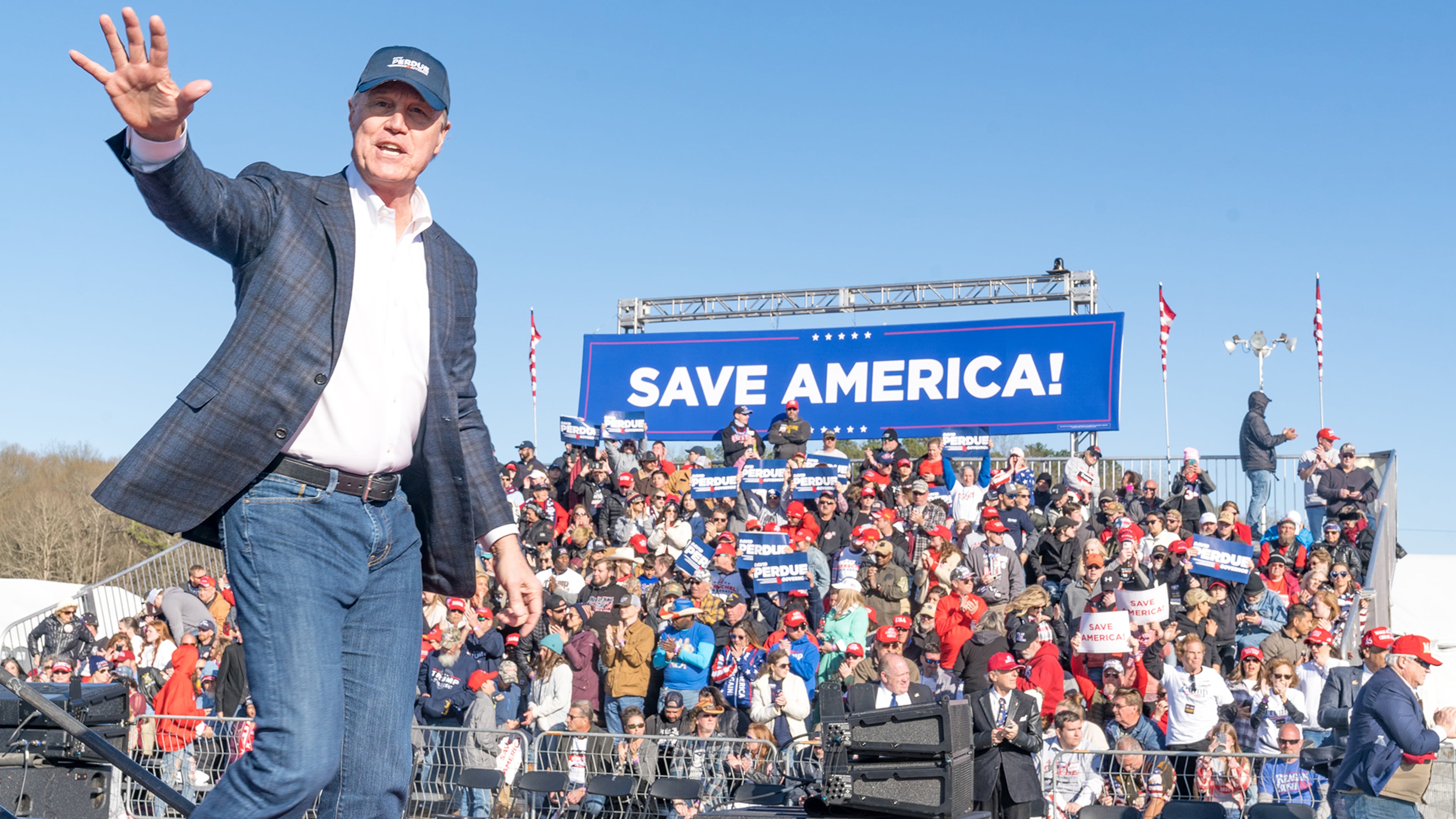 Former U.S. Senator and Republican candidate for Governor of Georgia David Perdue waves to supporters of former U.S. President Donald Trump after speaking at a rally at the Banks County Dragway on March 26, 2022, in Commerce, Georgia. (Megan Varner/Getty Images/TNS)