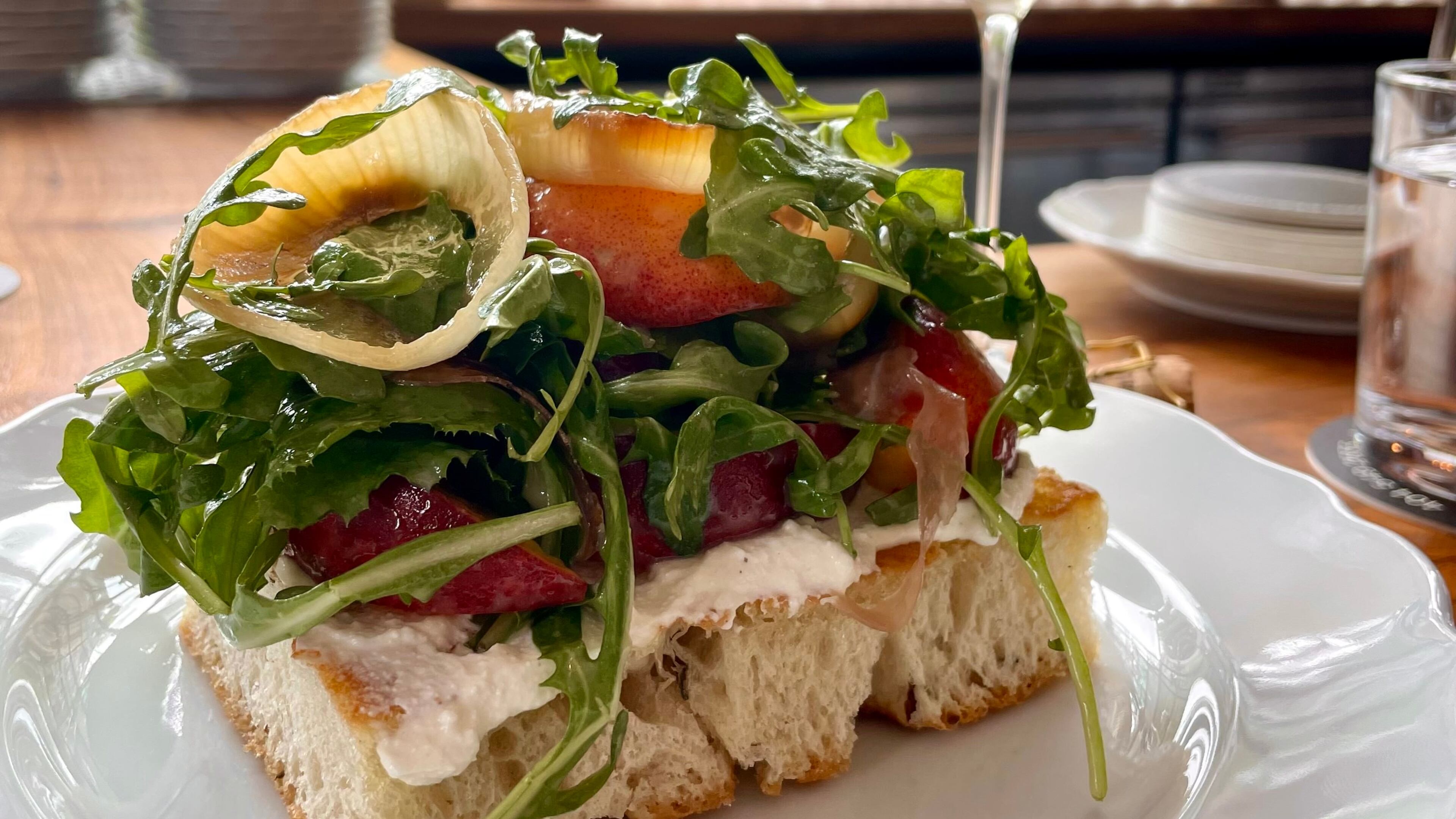 Finish off your meal at Lucian Books and Wine with the Peach tartine. (Angela Hansberger for the AJC)