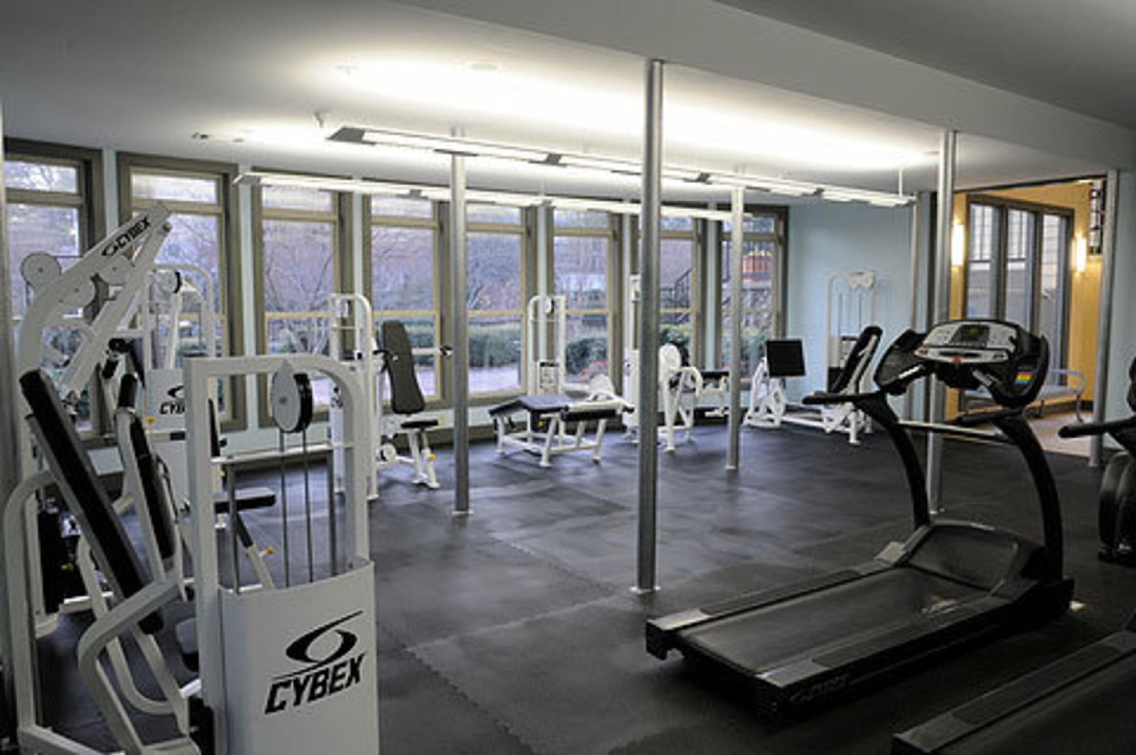 The community features a fitness center with plasma TVs and even offers tennis lessons for residents.