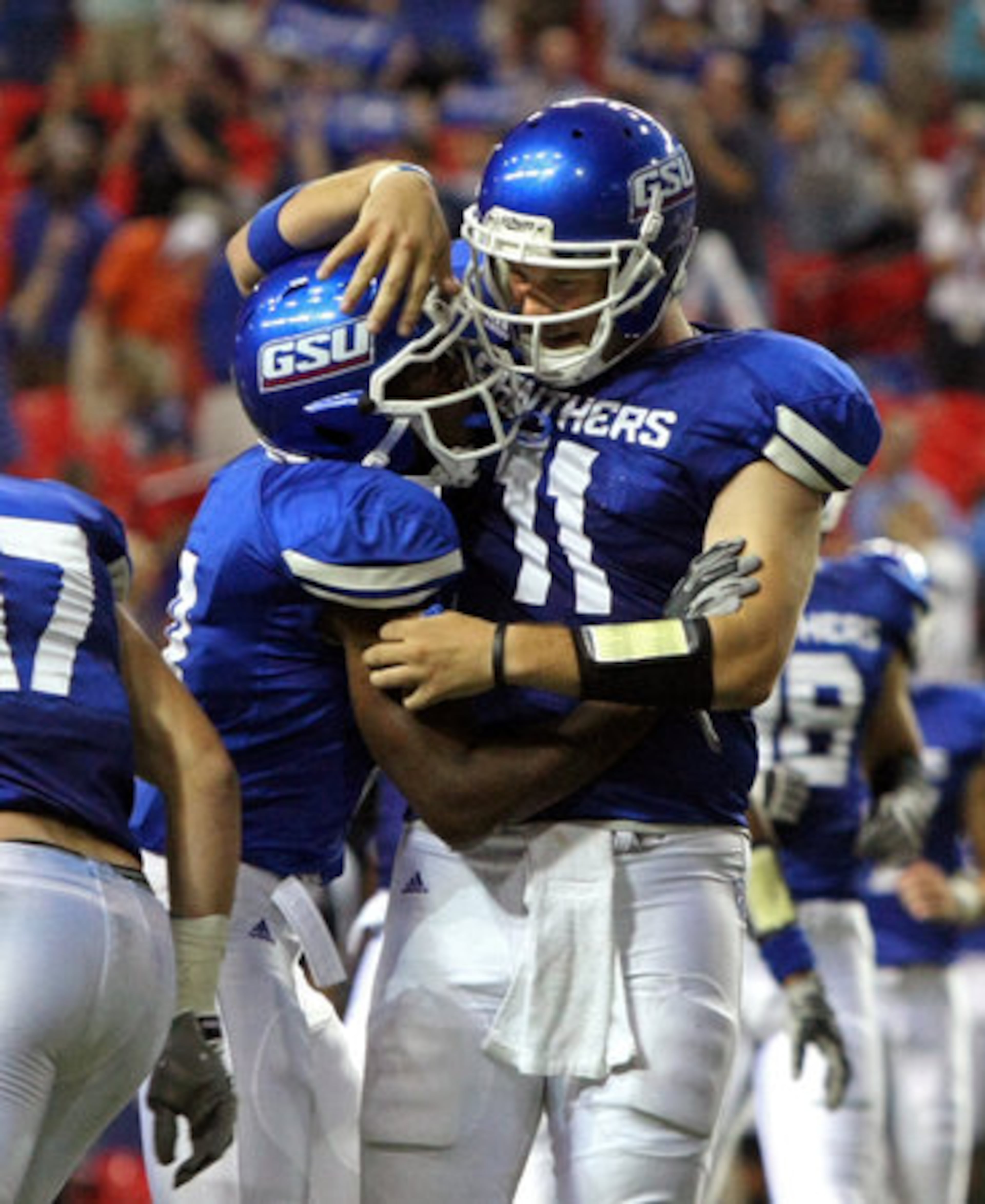GSU quarterback Drew Little (11) celebrates his 16-yard touchdown pass with wide receiver Jordan Giles (8), Little's second touchdown pass of the night during their 41-7 win over Shorter College for their first ever win in the Georgia Dome Thursday night in Atlanta, Ga., Sept. 2, 2010.