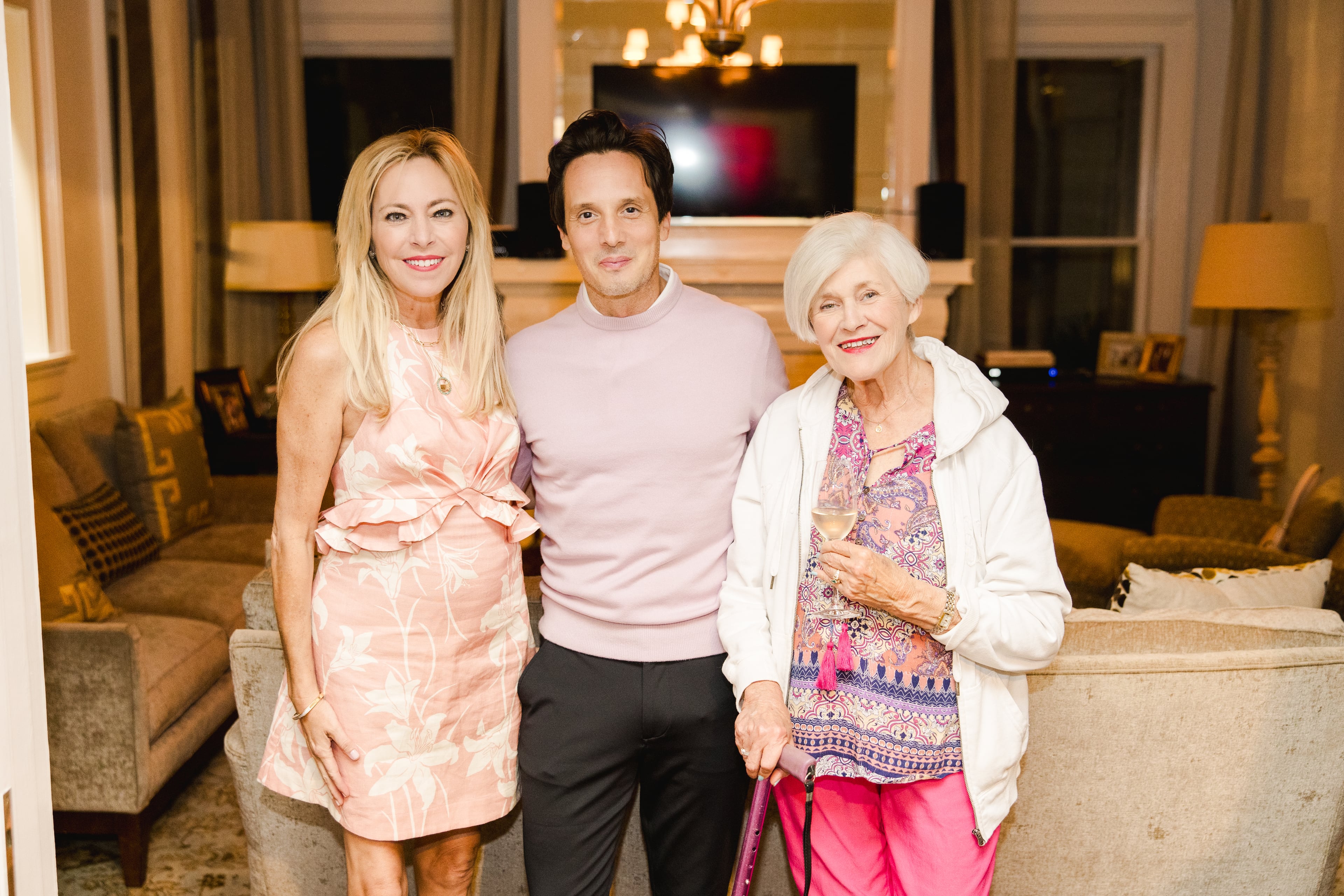 Stracke, left, poses with her mother, Reba Brown, right, and a guest during her 2024 Masters Tournament party in Augusta.