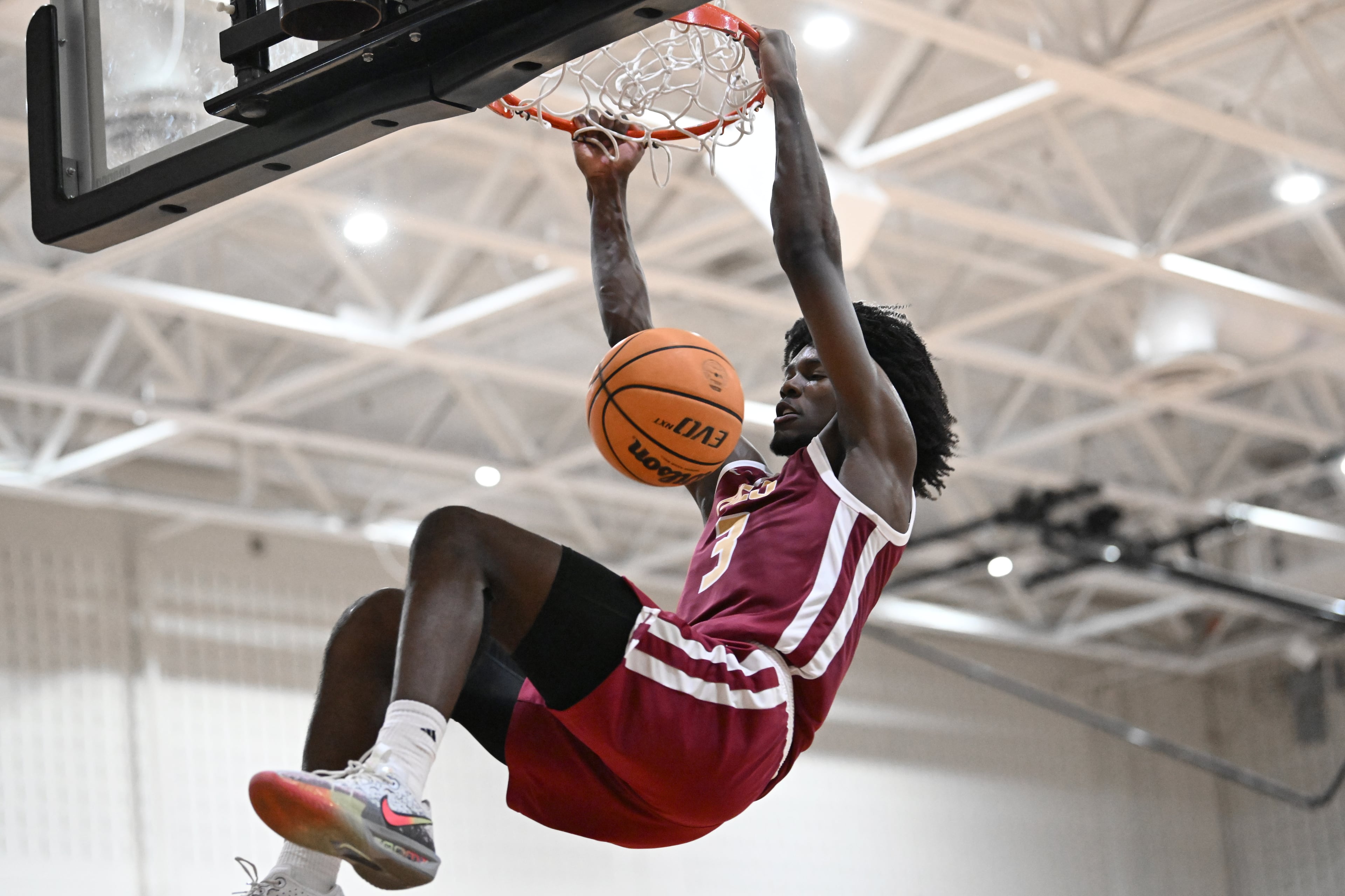 Holy Innocents Episcopal Devin Hutcherson (3) dunks the ball during Region 5AA Championship game at Therrell High School, Thursday, Feb. 19, 2026, in Atlanta. Holy Innocents Episcopal won 56-46 over KIPP Atlanta Collegiate. (Hyosub Shin/AJC)