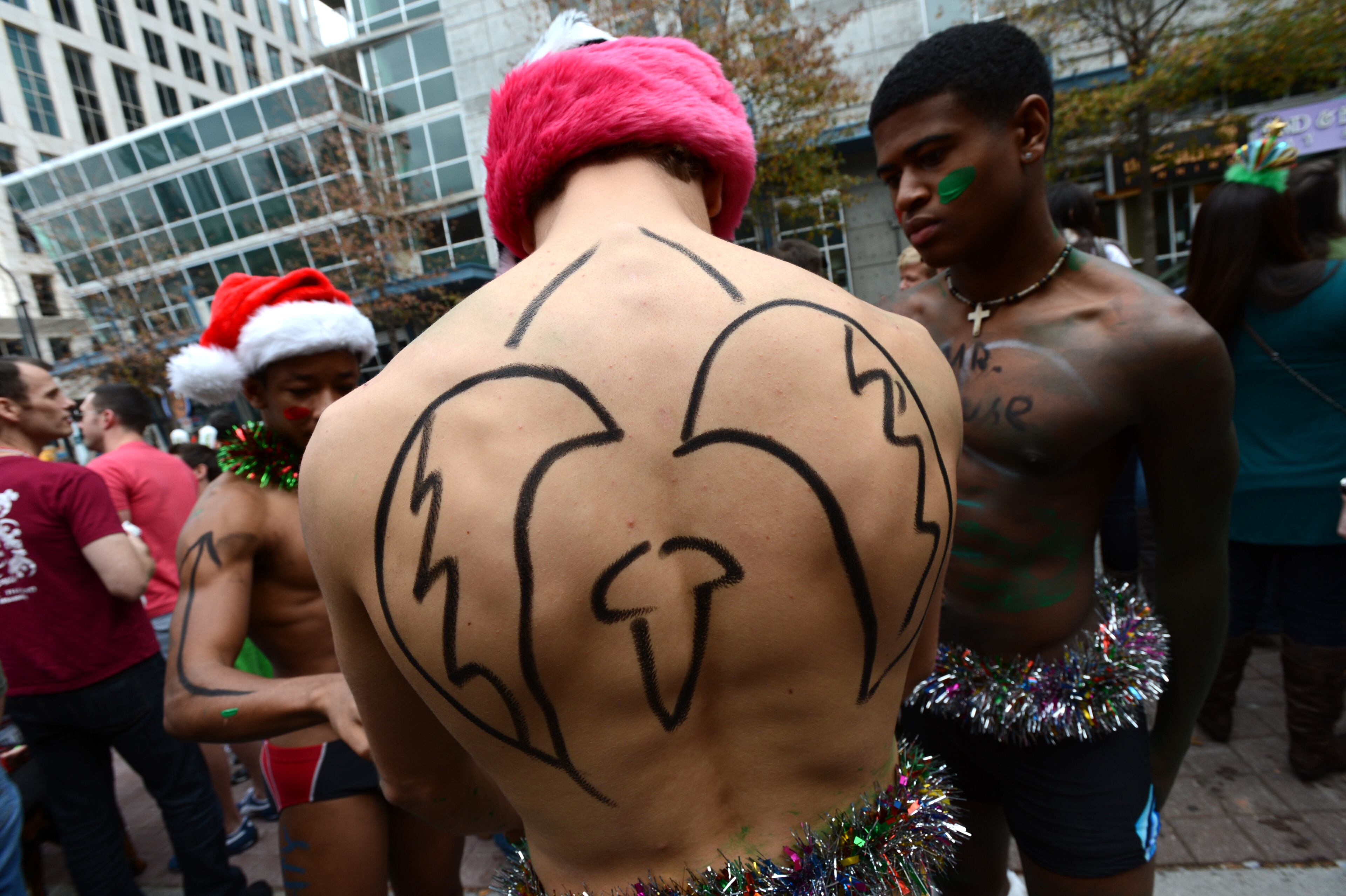 Caden Herring (foreground) and his friends Mekhi Richardson (left) and Jorden Albrights (right) get ready for the Atlanta Santa Speedo Run Saturday, Dec. 8, 2012. Approximately 300 runners took their positions at the starting line for a scantily clad 1.5 mile scramble through Midtown Atlanta. The Atlanta Santa Speedo Run has raised thousands of dollars for local charities over the years. Past recipients have included Bert's Big Adventure, Camp Twin Lakes and CHRIS Kids. The Santa Speedo Run was originally started in Boston in 2000 by five friends in search of a little holiday fun. It spread to Atlanta in 2009.