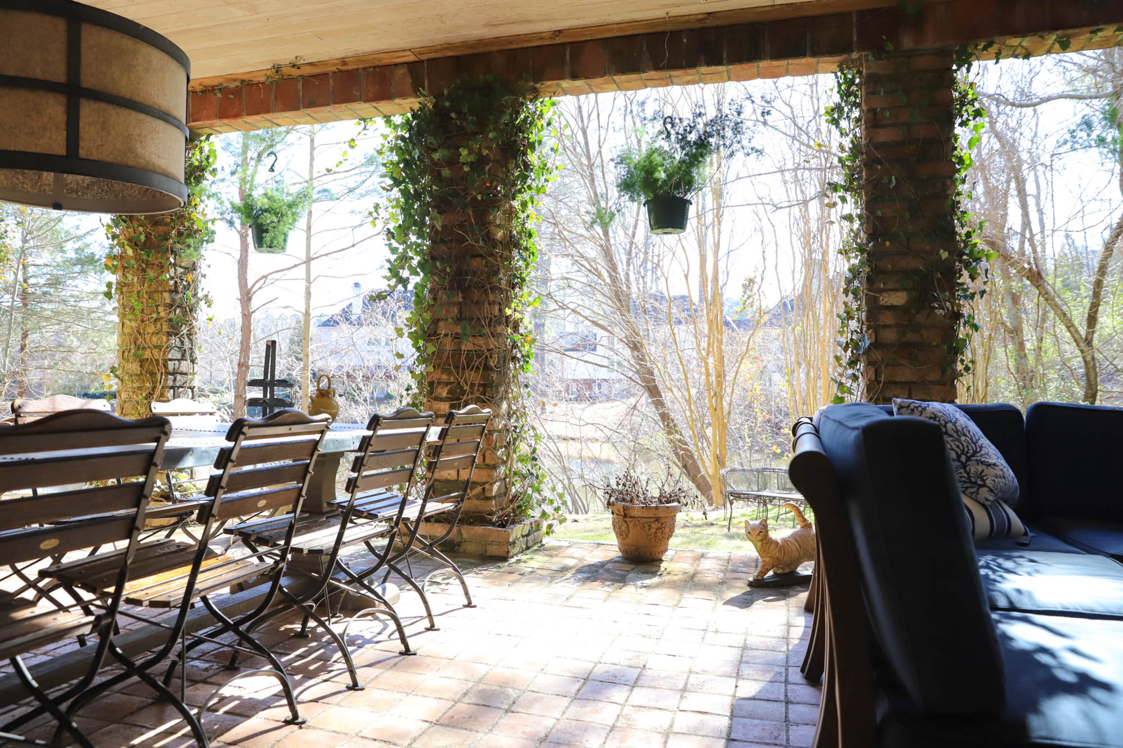 In 2016, Stacy and Joe Borocz decided to expand their downstairs patio to create a comfortable terrace space. They brought in terracotta tiles, built up the columns and planted ivy to create the earthy, cozy space. There is also seating and a TV, so that they can gather to watch movies or sports. Text by Shannon Dominy/Photo by Reynolds Rogers