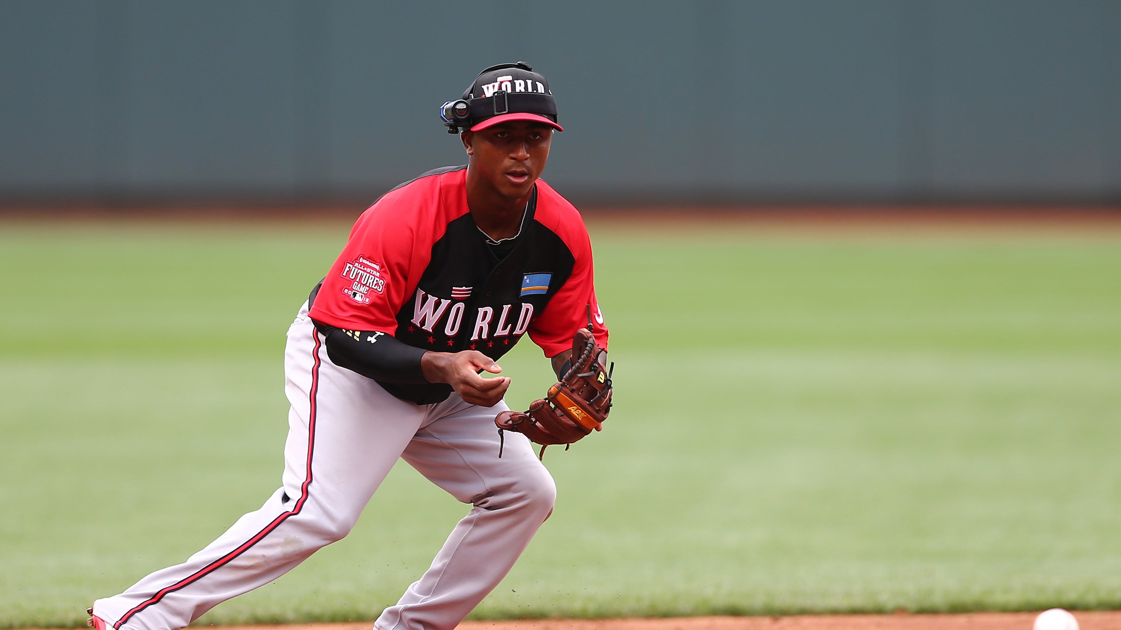 CINCINNATI, OH - JULY 12: Ozhaino Albies #7 of the World Team fields a ground ball during batting practice before the SiriusXM All-Star Futures Game at the Great American Ball Park on July 12, 2015 in Cincinnati, Ohio. (Photo by Elsa/Getty Images)
