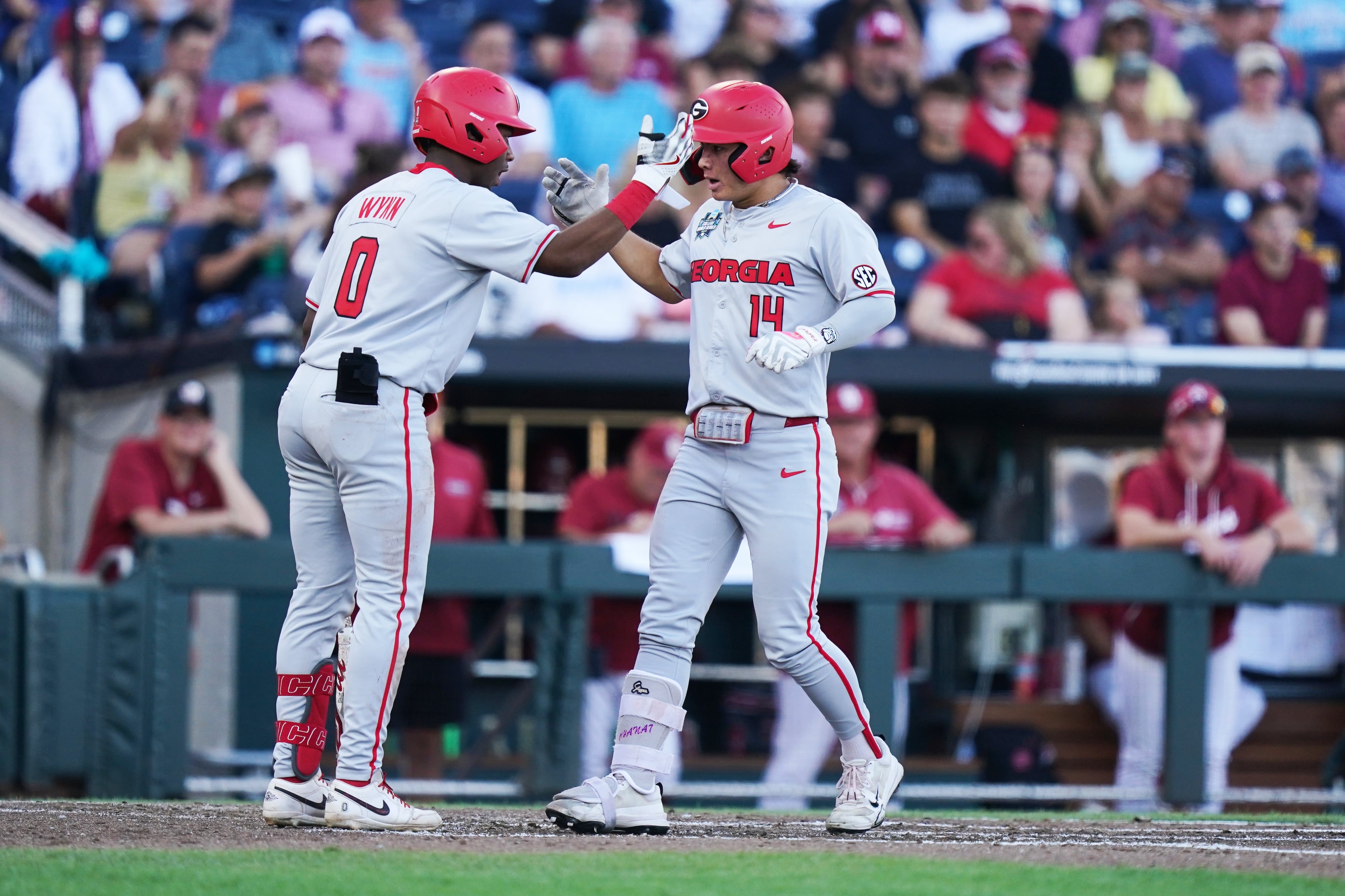 Georgia’s Kenny Ishikawa (right) is congratulated by infielder Ryan Wynn after hitting a homer during their College World Series game against Oklahoma on Monday, June 15, 2026, in Omaha, Neb. (Vera Nieuwenhuis/AP)