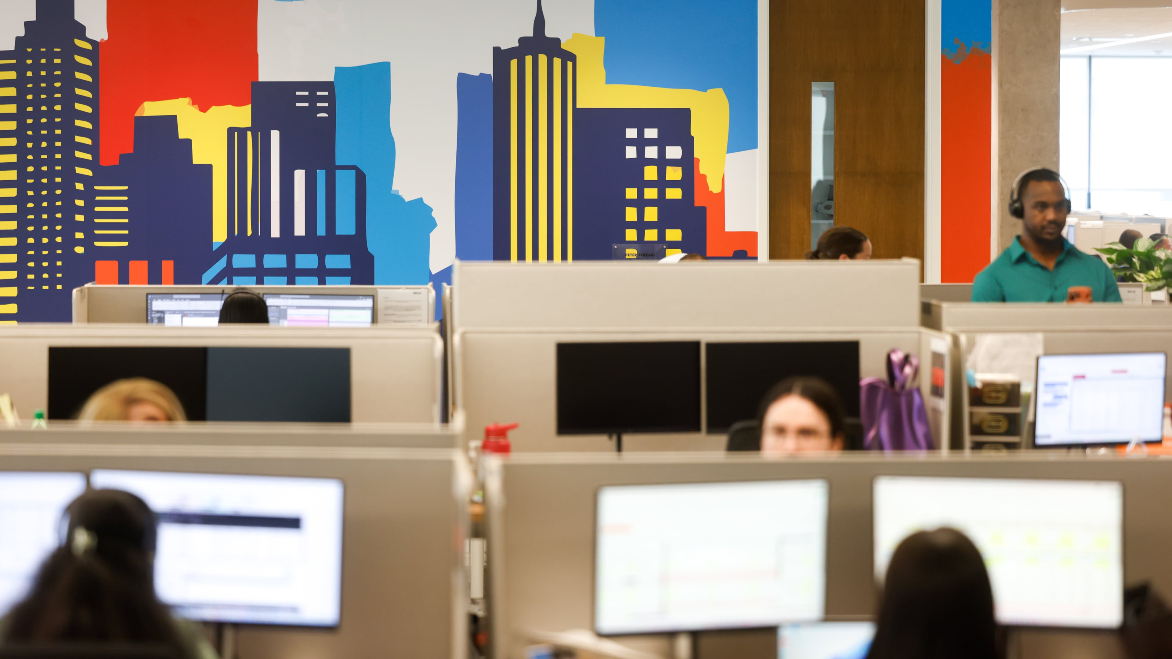 Employees work at the new TriNet office in Dunwoody on Aug. 18, 2026. The company plans to eventually house 750 employees at its offices within the High Street development. (Arvin Temkar/AJC)