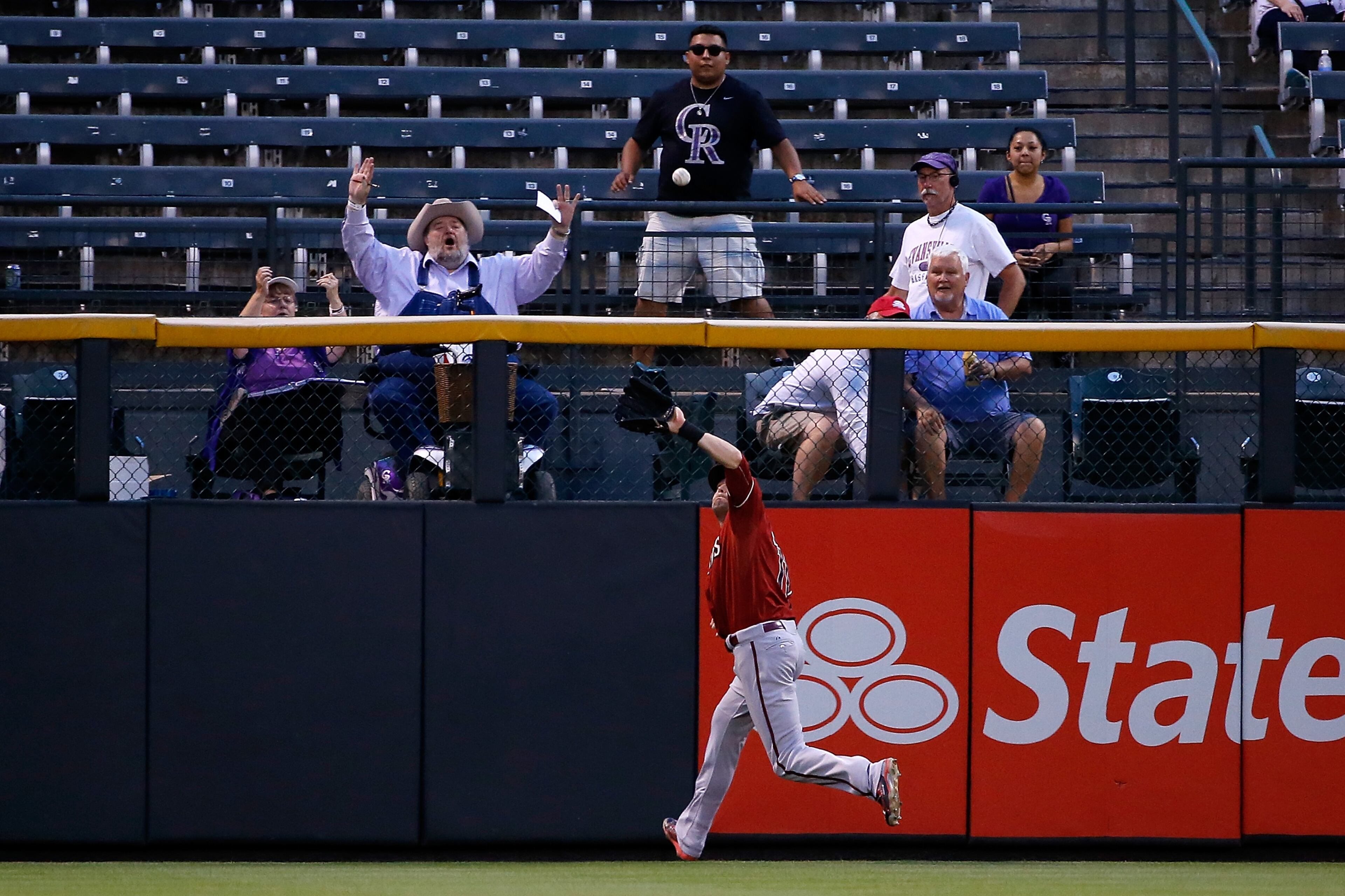 Left fielder Ender Inciarte of the Arizona Diamondbacks tracks down a fly ball against the Colorado Rockies as the fans react at Coors Field in 2015. (Photo by Doug Pensinger/Getty Images)