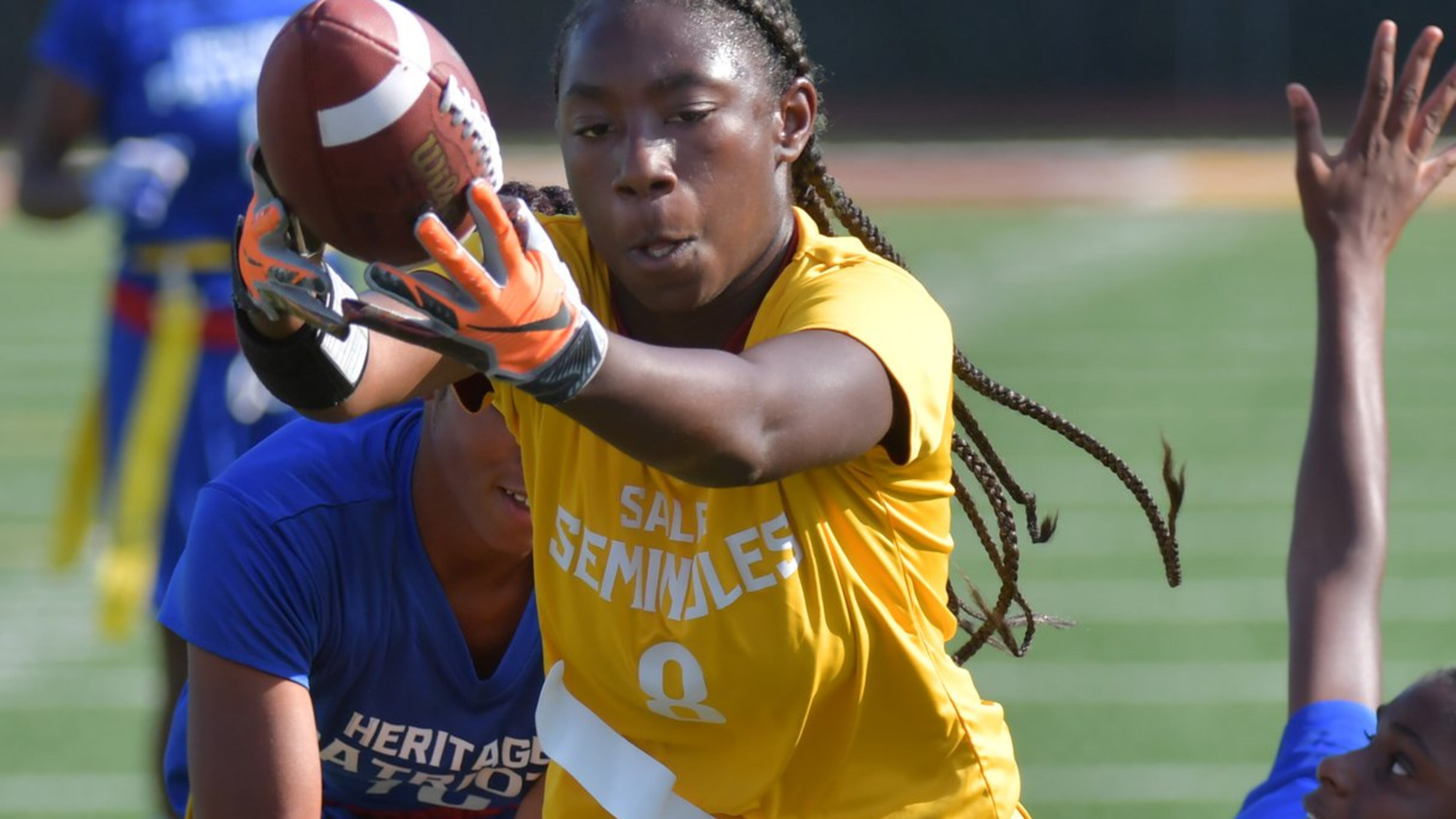 Salem’s Keyonna Brown runs the ball upfield during the girls flag football season opener against the Heritage at Salem High School in Conyers on Thursday, Sept. 12, 2019. HYOSUB SHIN / HYOSUB.SHIN@AJC.COM
