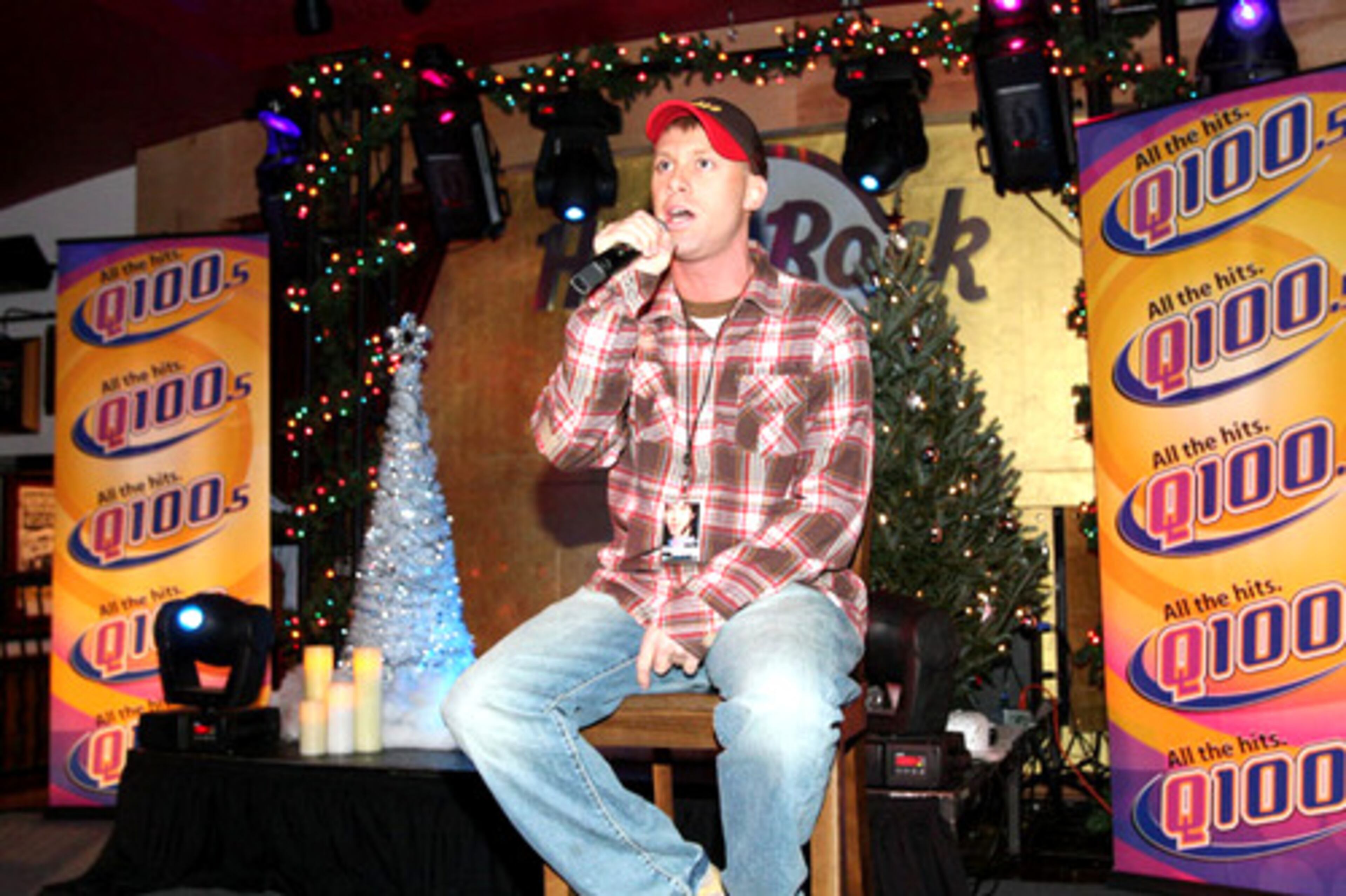 Q100 nighttime jock Adam Bomb introduces Elliott Yamin.