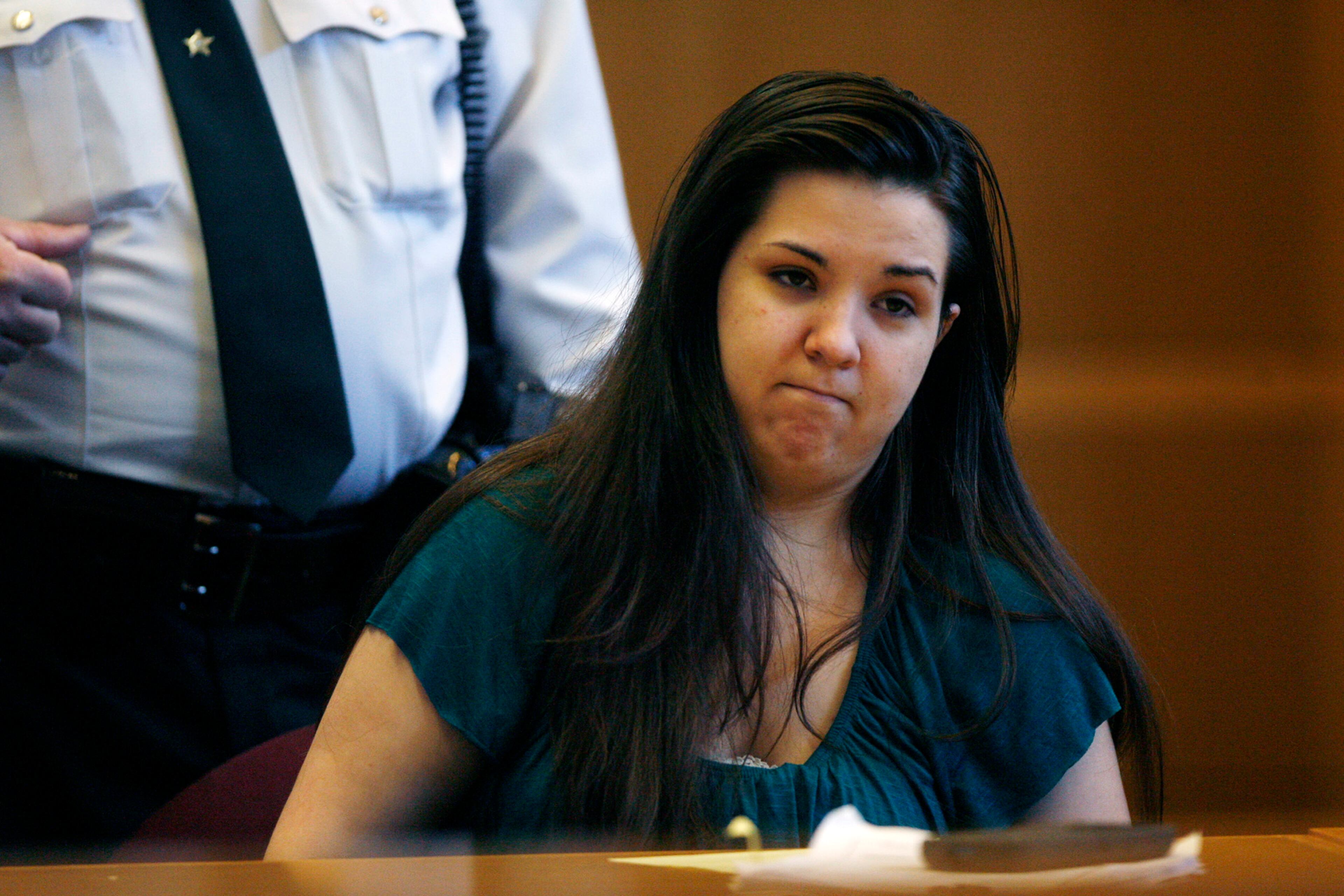 Jennifer Mee, center, sits in court as jury selection begins her murder trial, Tuesday, Sept. 17, 2013, at the Pinellas County Justice Center in Clearwater, Fla. Mee, 22, who found fame in 2007 as a teen because of her uncontrollable hiccupping, is charged with first-degree murder in the 2010 death of Shannon Griffin. (AP Photo/The Tampa Bay Times, Scott Keeler, Pool)
