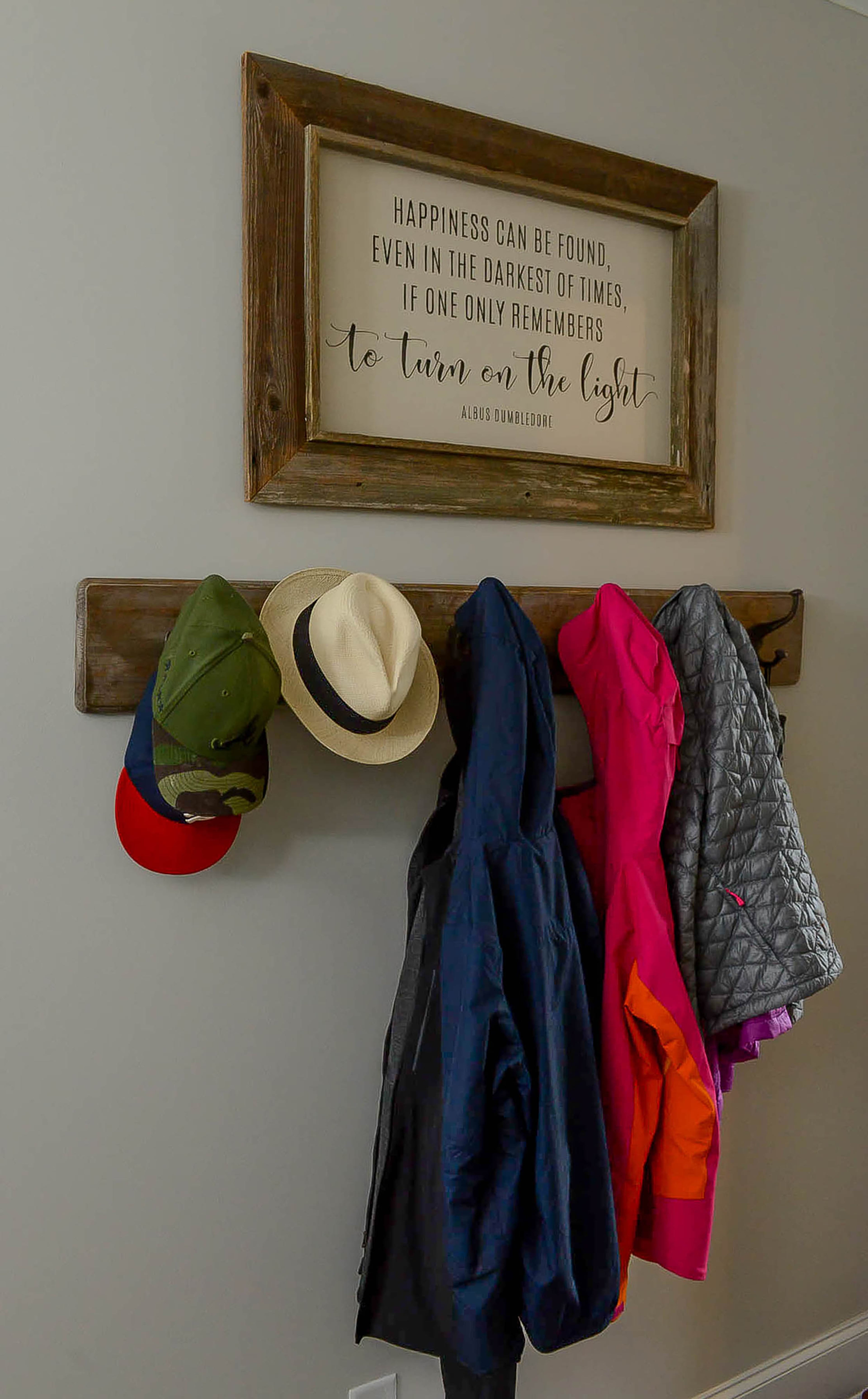 A quote from "Harry Potter" and a simple rustic coat rack greet the family and visitors in the Roswell townhome.