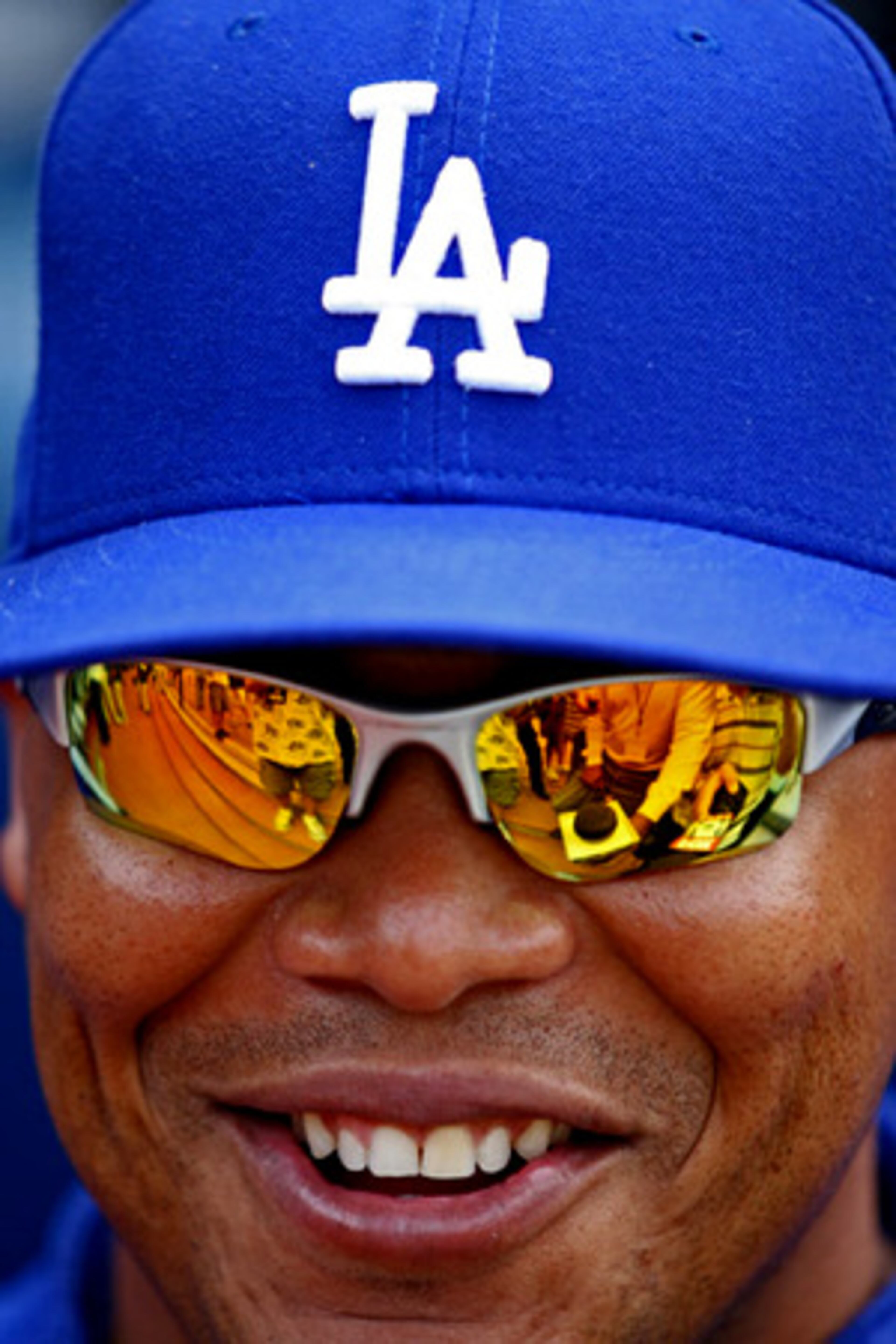 On Friday, former Braves centerfielder Andruw Jones, wearing his trademark shades, talks to members of the media before the start of his first game in Atlanta since signing with the Los Angeles Dodgers.