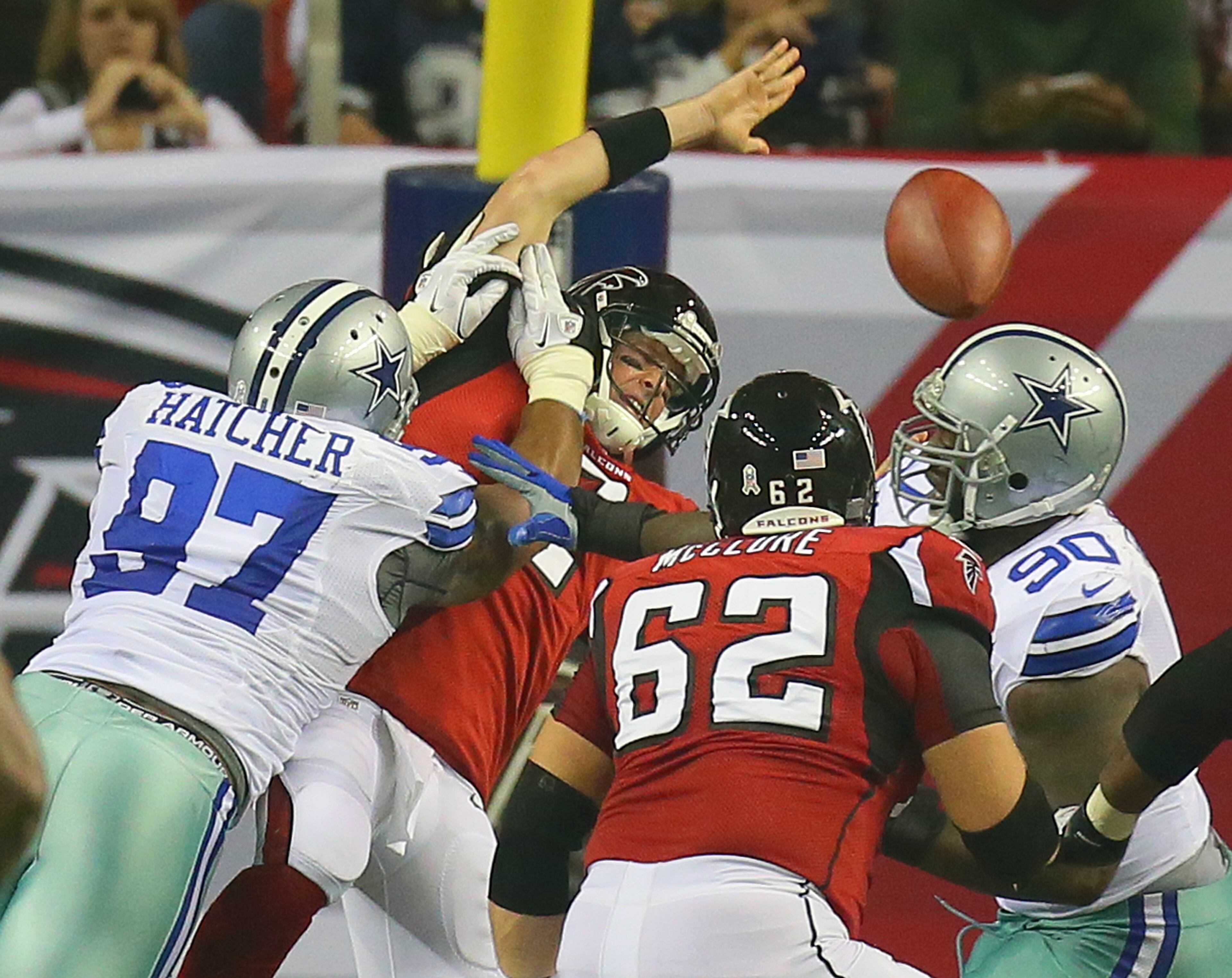 Atlanta Falcons quarterback Matt Ryan takes a hard hit from Dallas Cowboys defensive tackle Jason Hatcher as he just gets off a completed pass to Jacquizz Rodgers on the final drinve of the 1st half on the way to tieing the game 6-6 with a field goal at the Georgia Dome in Atlanta on Sunday, Nov. 4, 2012. CURTIS COMPTON / CCOMPTON@AJC.COM