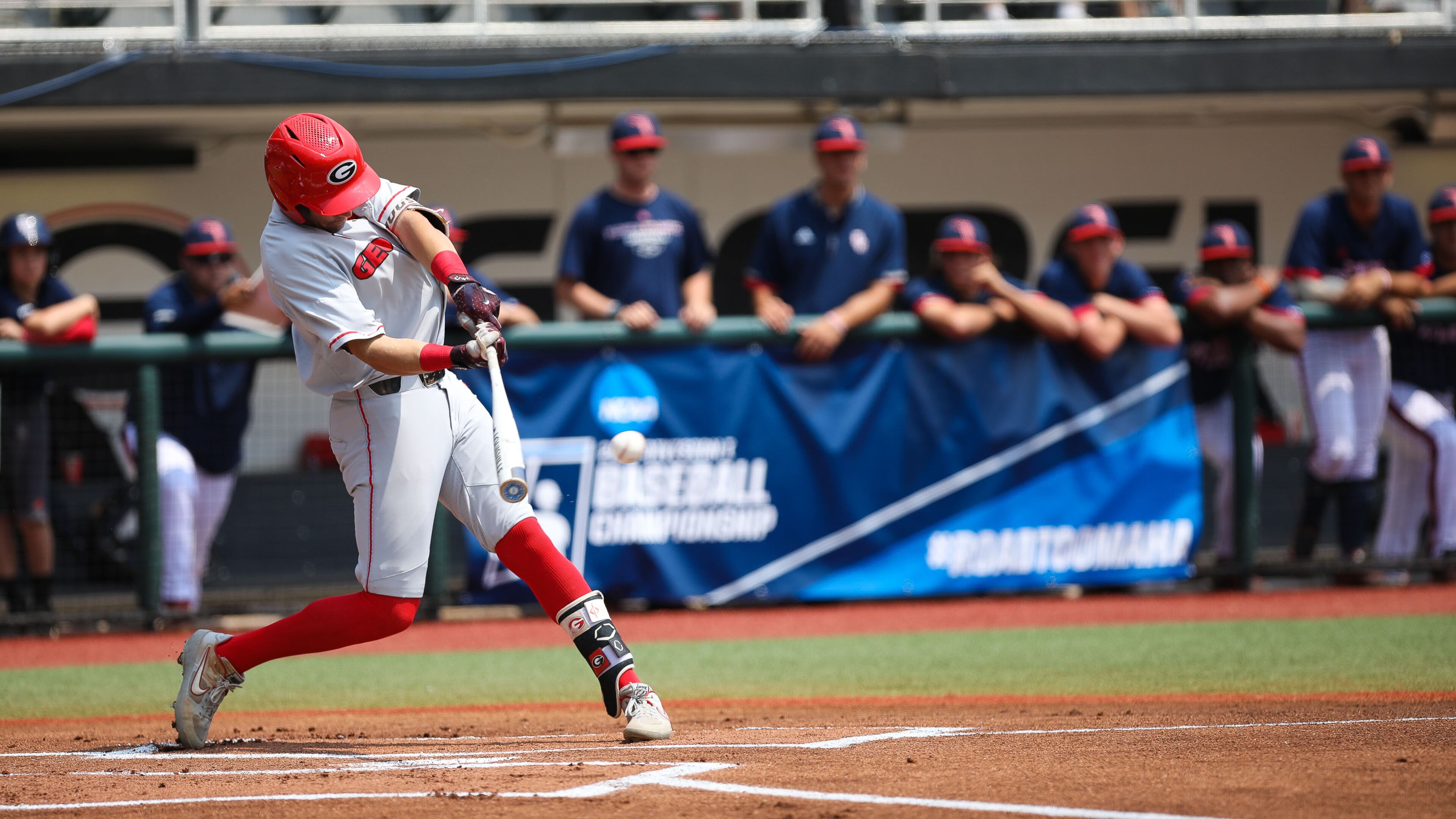 Georgia outfielder Riley King (31) hits a single during the NCAA regional baseball game against Florida Atlantic Sunday, June 2, 2019, at Foley Field in Athens.