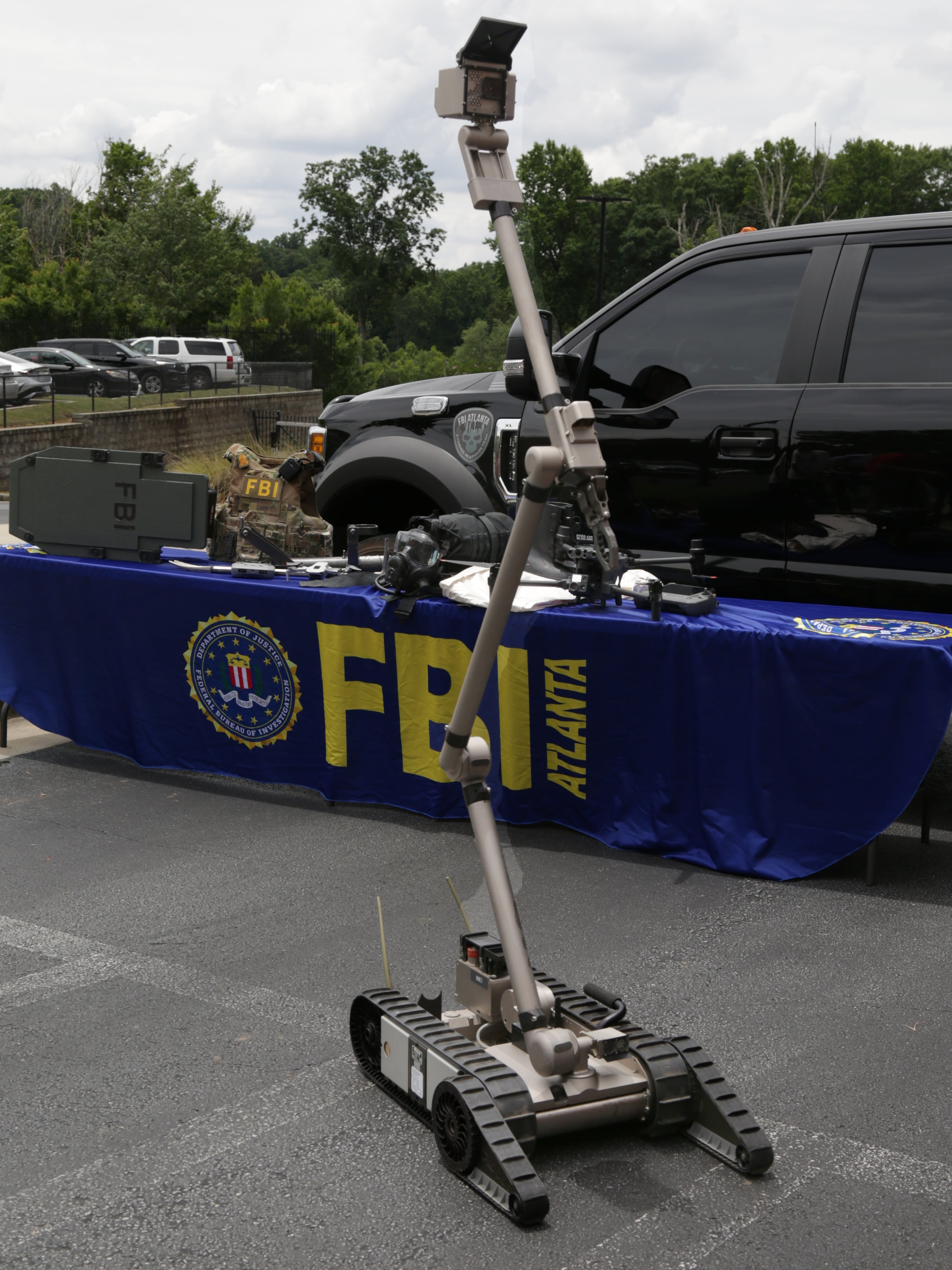 A bomb-detecting robot is shown during a press conference addressing the FBI’s safety plans for the 2026 FIFA World Cup in Atlanta. (Akili-Casundria Ramsess for the AJC)