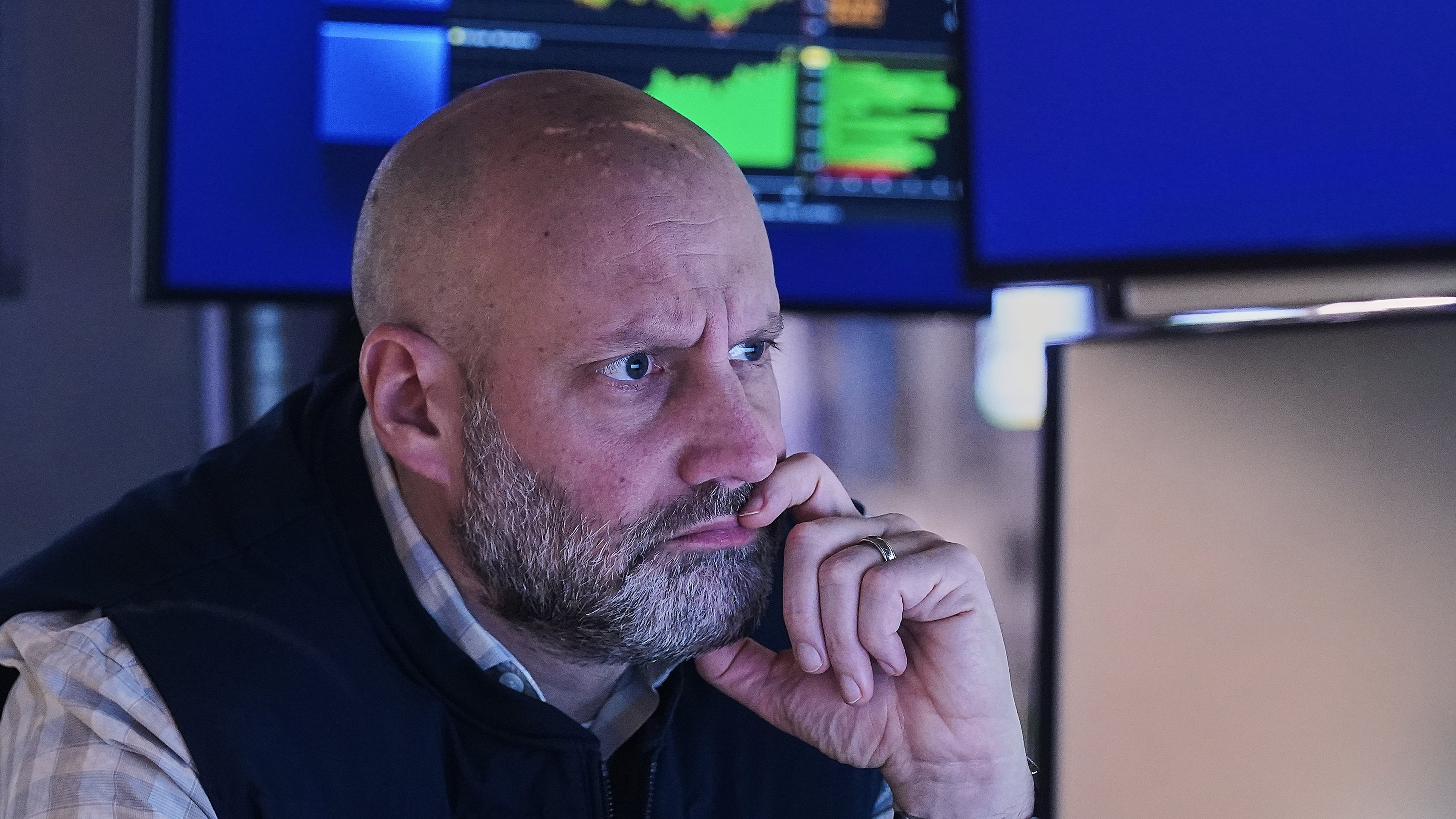 Specialist Meric Greenbaum works at his post on the floor of the New York Stock Exchange, Monday, Jan. 26, 2026. (AP Photo/Richard Drew)