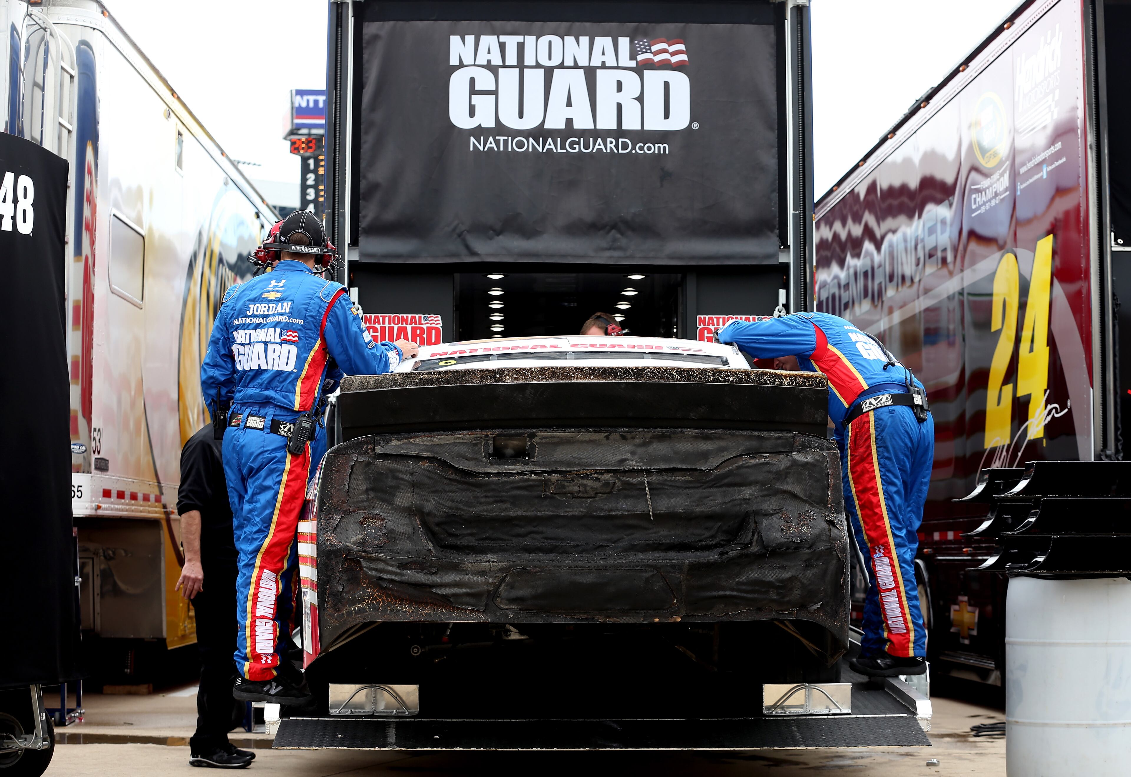 The car of Dale Earnhardt Jr., driver of the #88 National Guard Chevrolet, is loaded in to a hauler after crashing and catching fire during the NASCAR Sprint Cup Series Duck Commander 500 at Texas Motor Speedway on April 7, 2014 in Fort Worth, Texas. (Photo by Chris Graythen/Getty Images for Texas Motor Speedway)