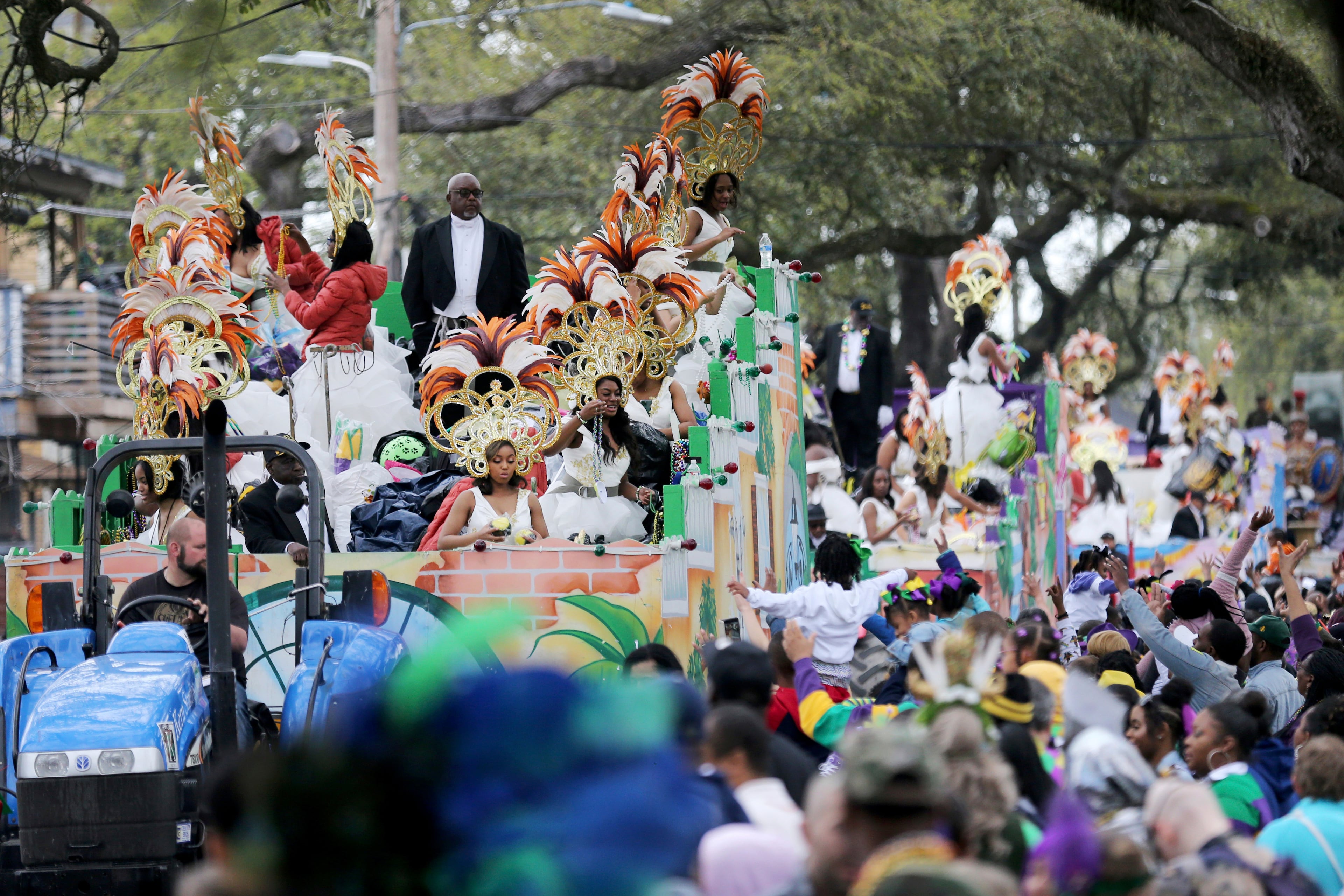 The Krewe of Zulu Parade rolls down Jackson Avenue on Mardi Gras Day in New Orleans.