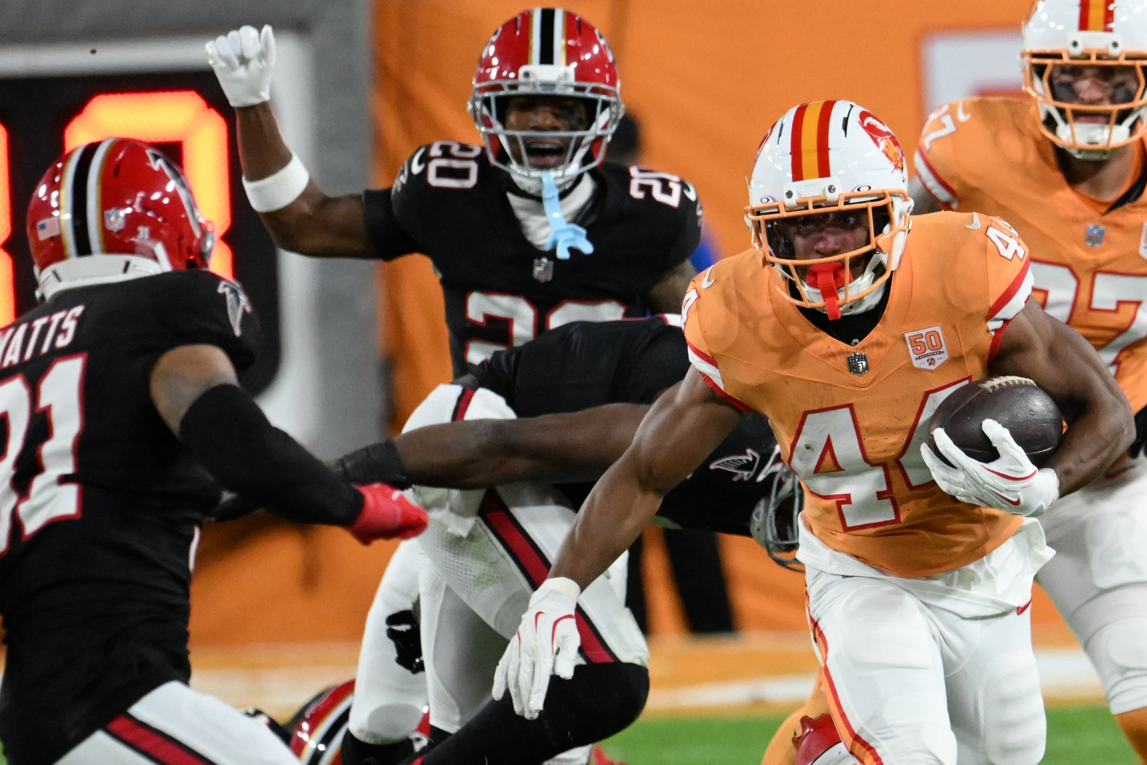 Tampa Bay Buccaneers running back Sean Tucker (44) runs against the Atlanta Falcons during the first half of an NFL football game, Thursday, Dec. 11, 2025, in Tampa, Fla. (AP Photo/Jason Behnken)