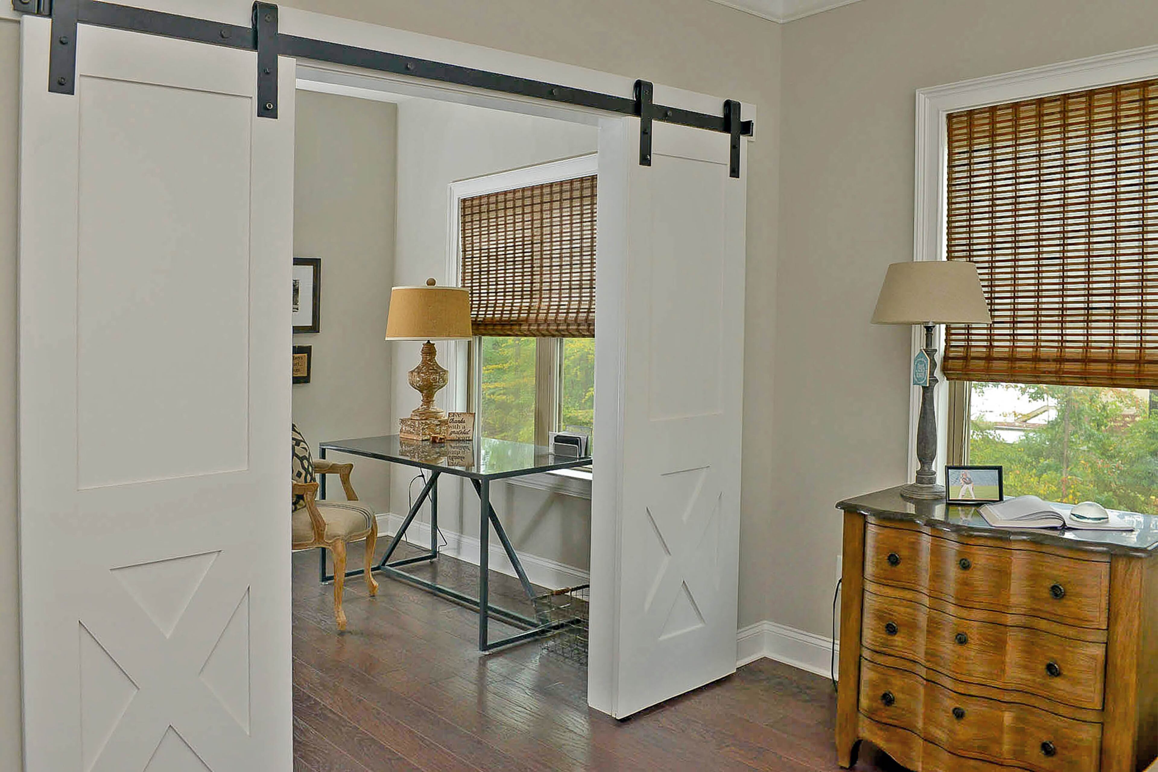 The sliding barn doors that separate bedrooms from sitting and study areas are an option by builder Edward Andrews Homes in townhomes in Roswell's Harlow community.