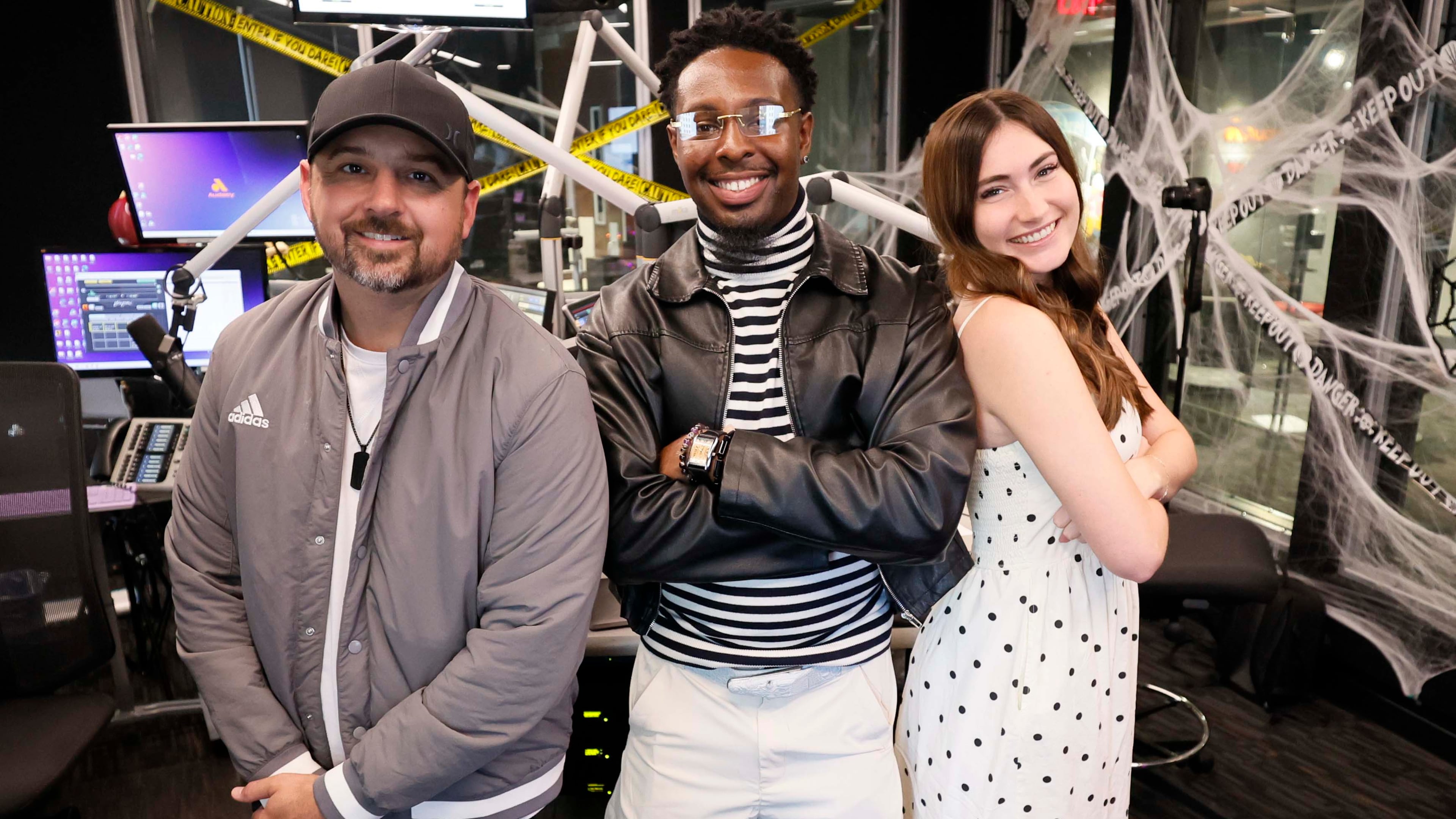 Bret Mega (left) of “The Bret Mega Show,” poses with co-hosts Chris Smith and Anna “AB” Bohlmann at Star 94 (WSTR-FM), Atlanta, on Tuesday, Oct. 20, 2026. “The Bret Mega Morning Show” debuts this week, marking Star’s ninth morning configuration since early 2018. (Miguel Martinez/AJC)