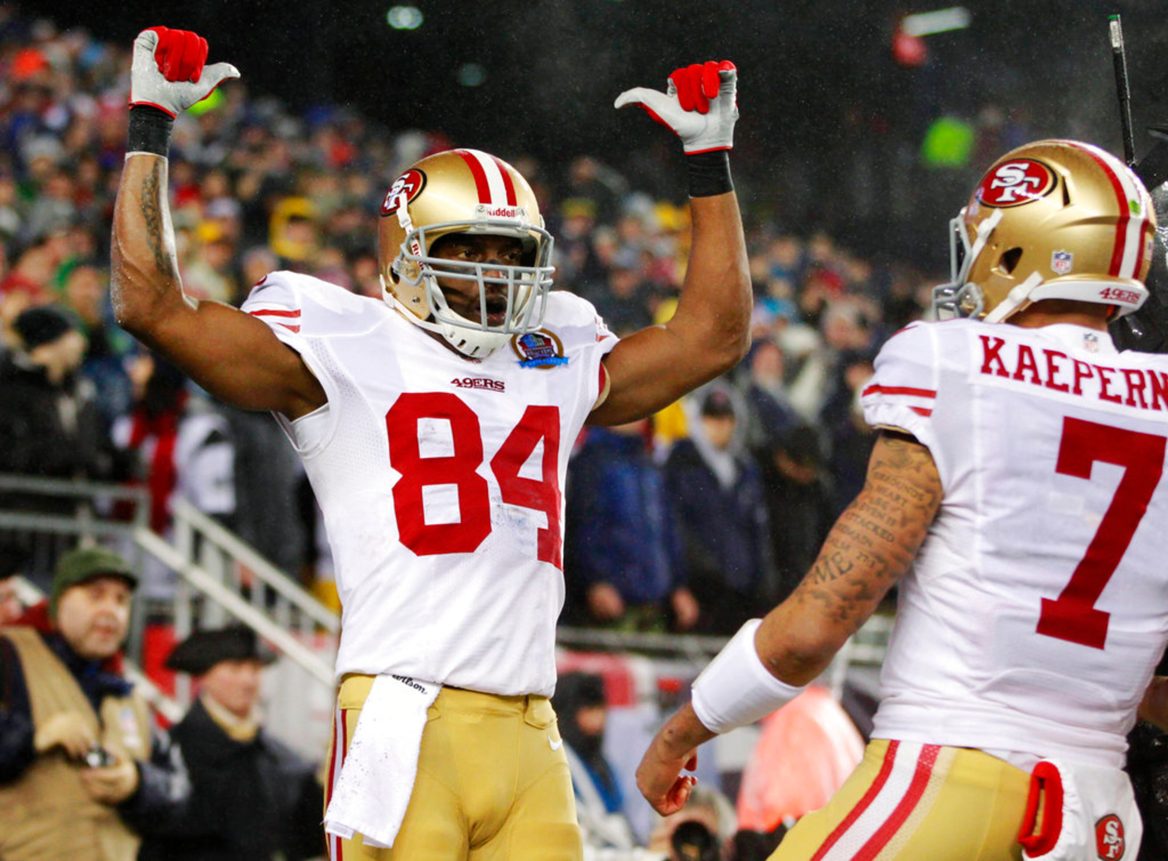 FILE - In this Sunday, Dec. 16, 2012 file photo, San Francisco 49ers wide receiver Randy Moss (84) celebrates a touchdown catch during the first quarter of an NFL football game against the New England Patriots in Foxborough, Mass. Moss was elected to the Pro Football Hall of Fame on Saturday, Feb. 3, 2018. AP Photo/Steven Senne, File)