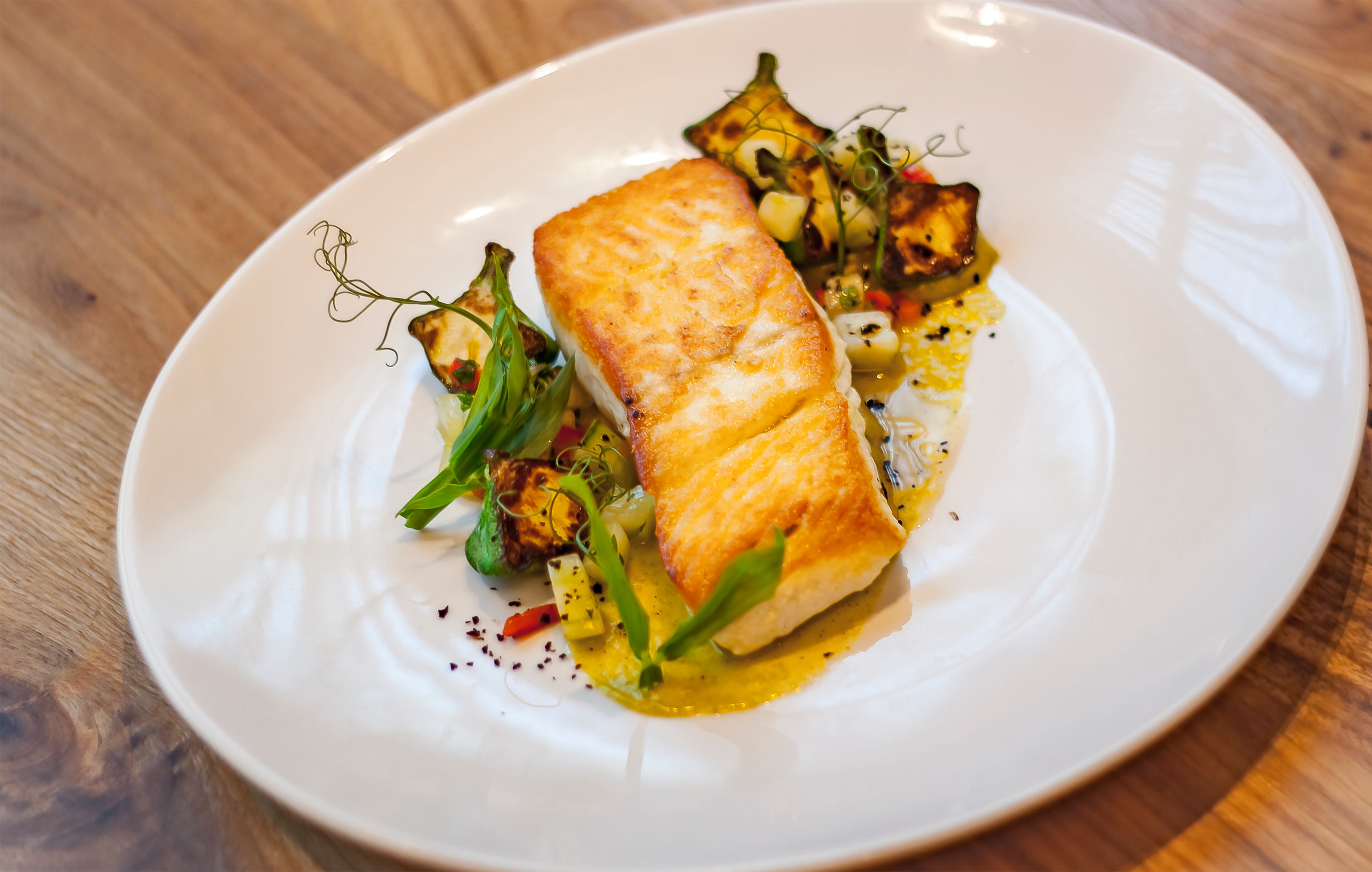 Noble Fin in Peachtree Corners is a new seafood concept where fresh market fish dishes, like this halibut, offer a true coastal dining experience. Read more about Noble Fin and 24 hours of eating in Gwinnett.(Photo credit: Noble Fin)