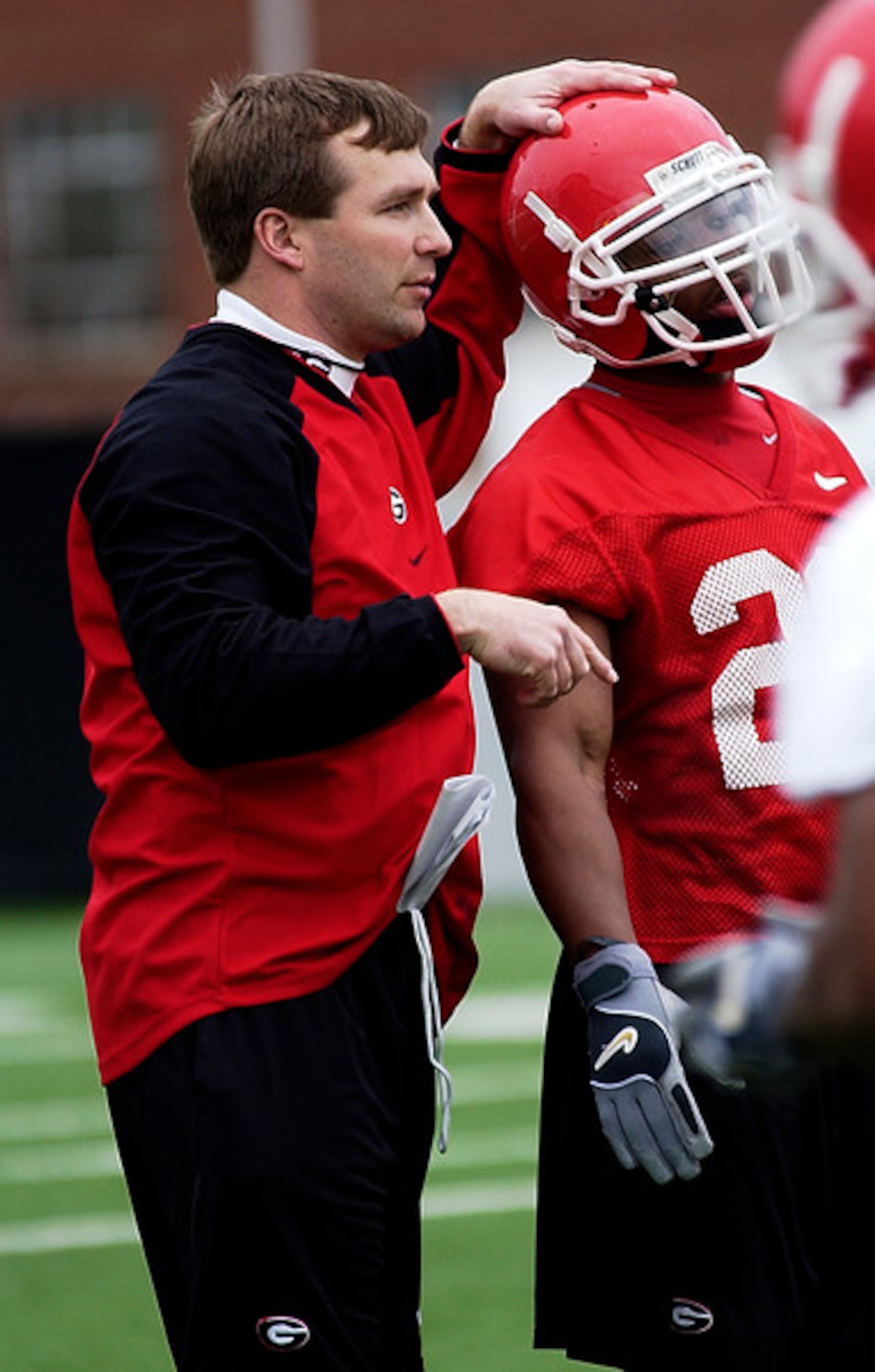 Kirby Smart works with running back Thomas Brown, who is now an assistant coach. (Photo courtesy of UGA Athletics)
