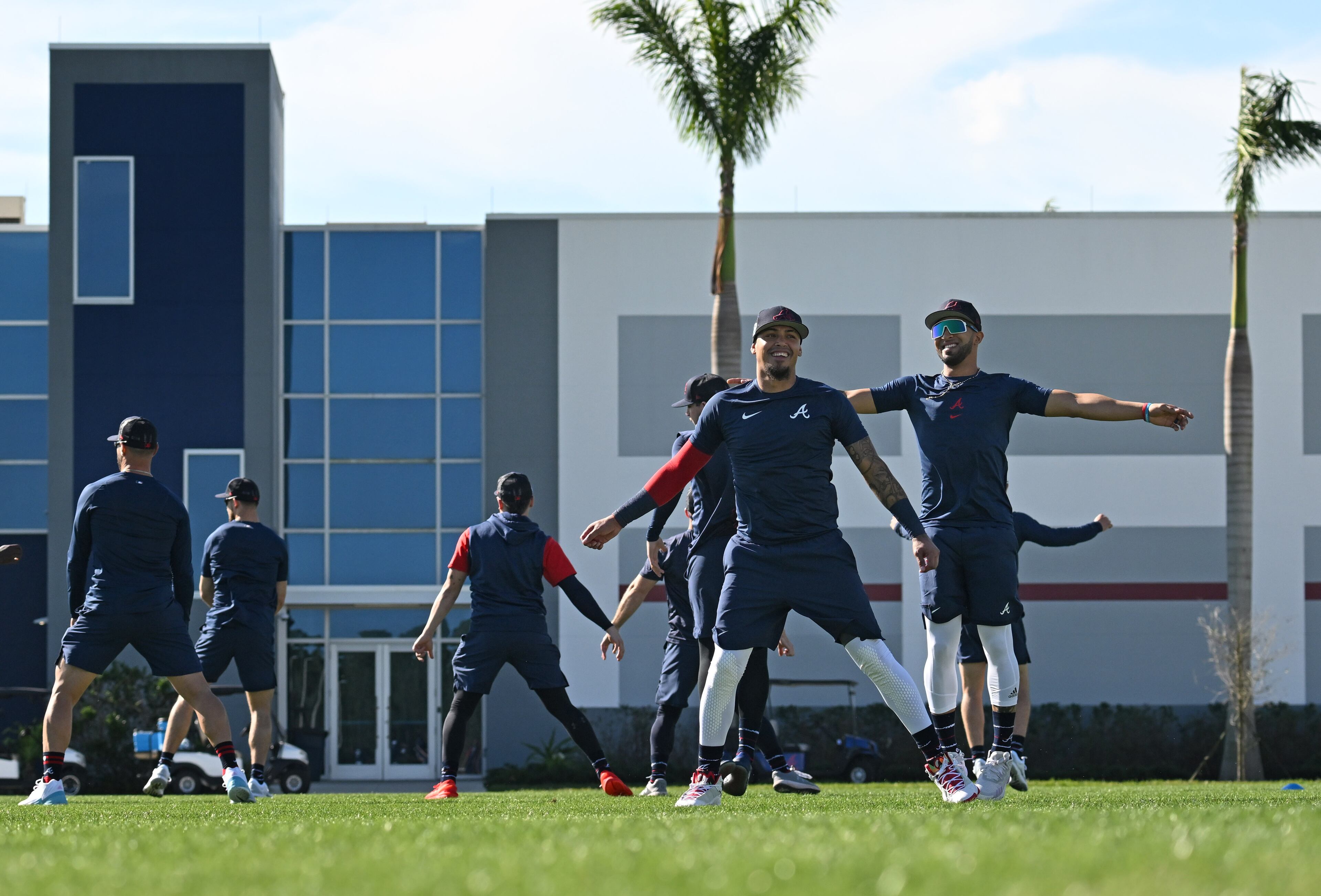 Braves players warm up during spring training Thursday at CoolToday Park in North Port, Florida. (Hyosub Shin / Hyosub.Shin@ajc.com)