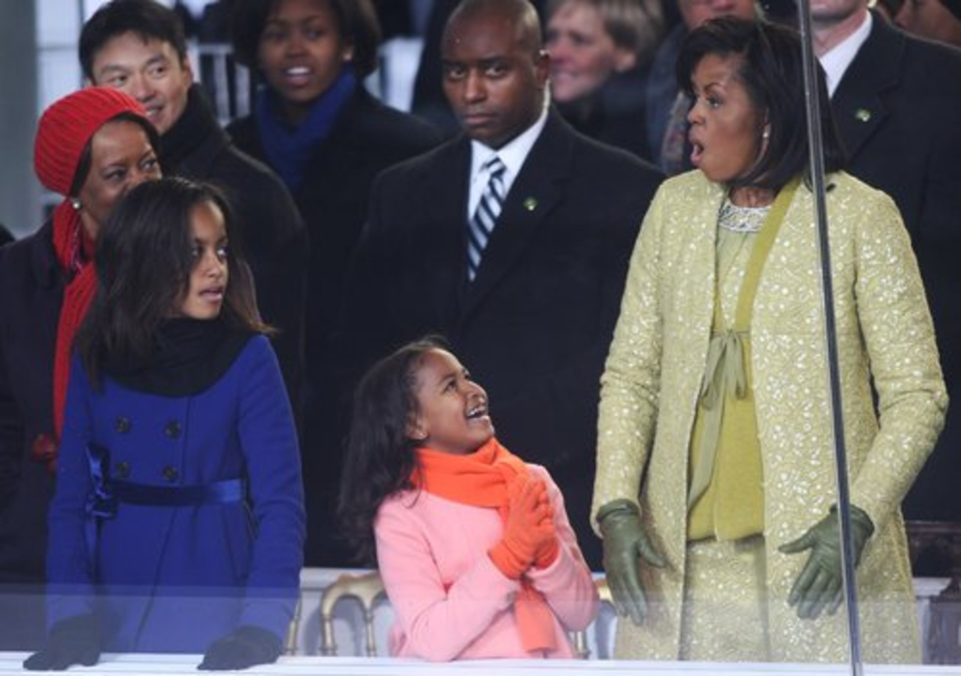 Daughter Shasha seems to get a kick out of her mom's reaction during the inaugural parade.