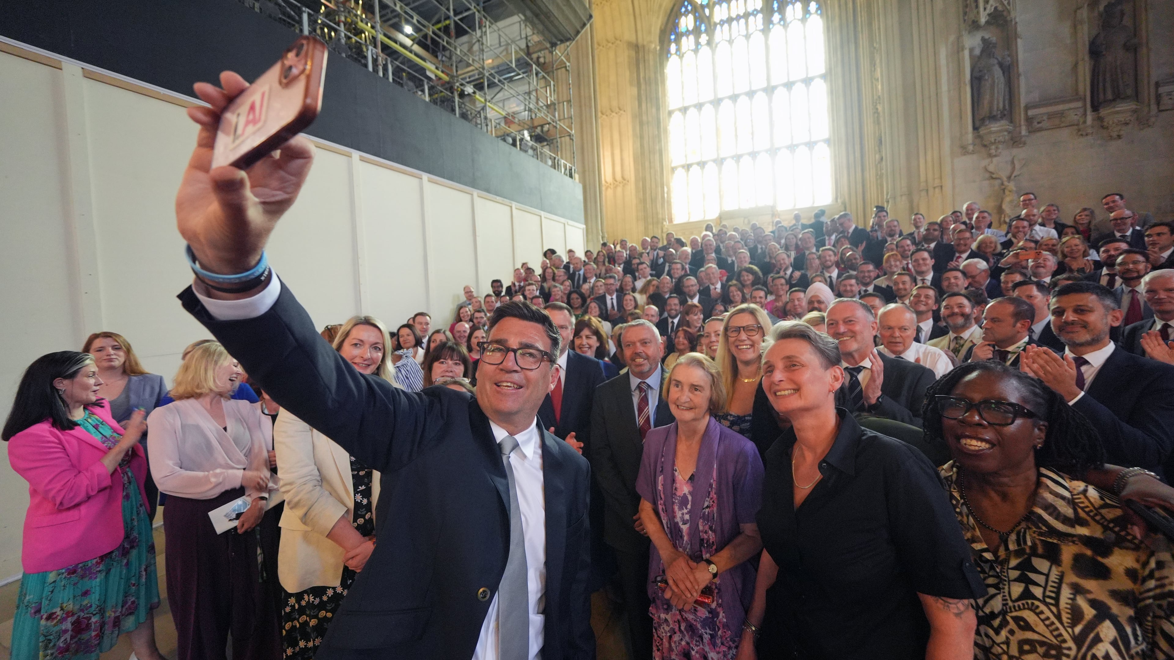Andy Burnham with colleagues from the Parliamentary Labour Party in Westminster Hall at the Houses of Parliament in central London, as he returns to the House of Commons to take up his seat after winning the Makerfield by-election, Monday June 22, 2026. (Yui Mok/PA via AP)