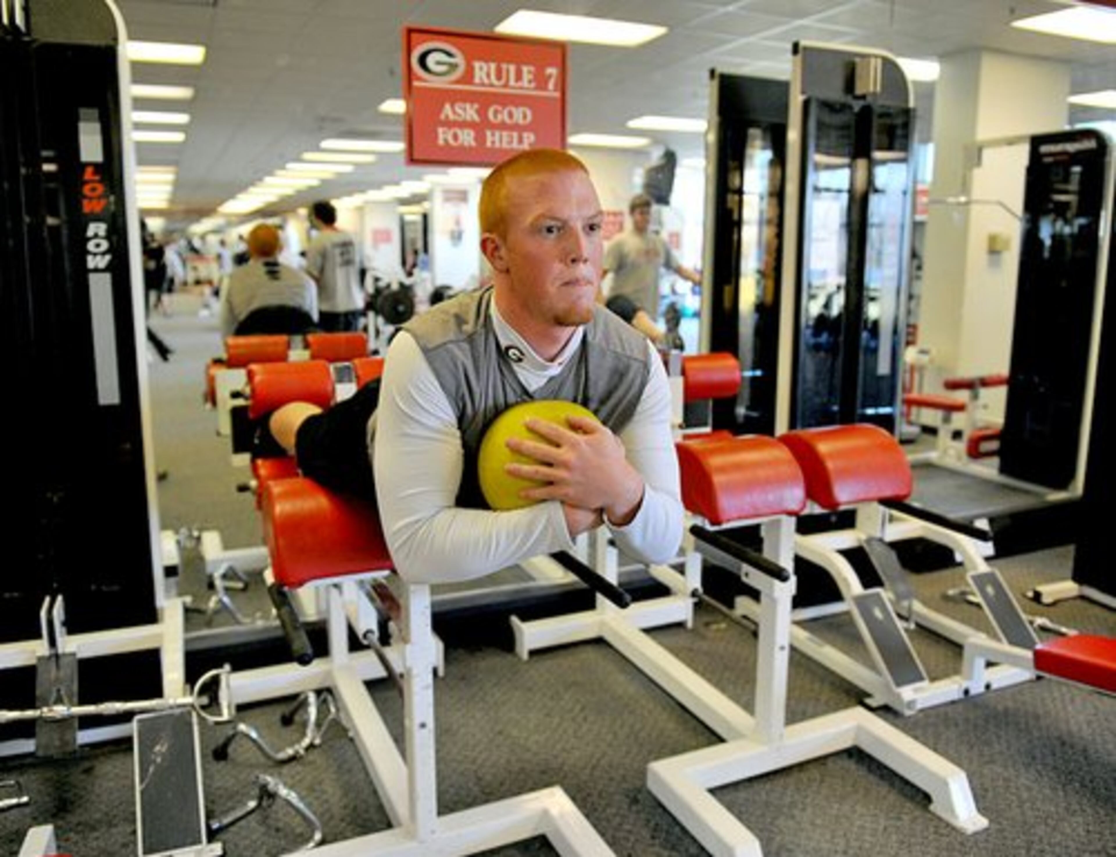 Georgia quarterback Joe Cox works out on a Roman Chair with a medicine ball. Cox takes over Matthew Stafford as the Bulldogs' starting quarterback.