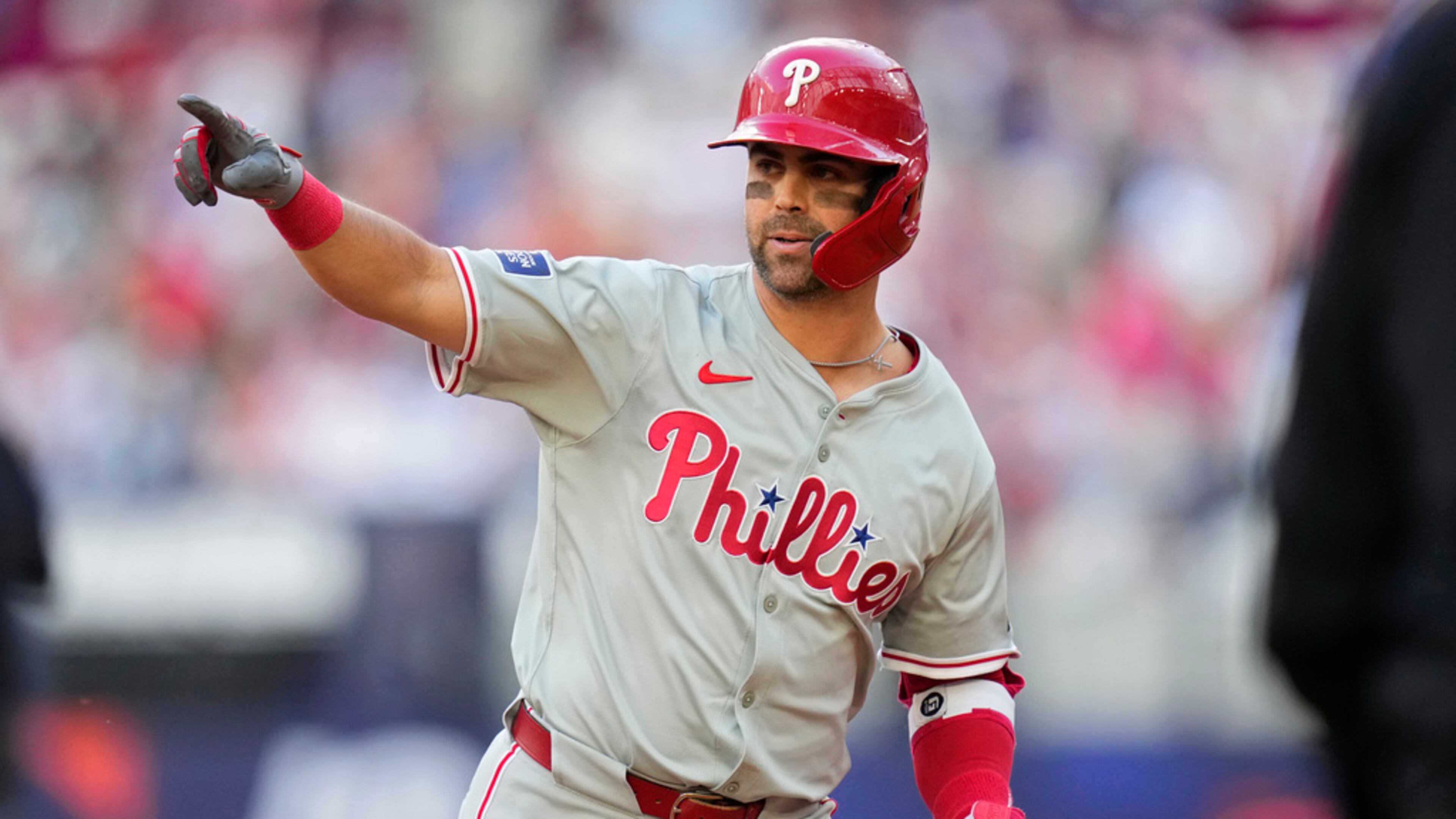 Philadelphia Phillies' Whit Merrifield celebrates after hitting a 3-run home run against the New York Mets during the fourth inning of a London Series baseball game in London, Saturday, June 8, 2024. (AP Photo/Kirsty Wigglesworth)