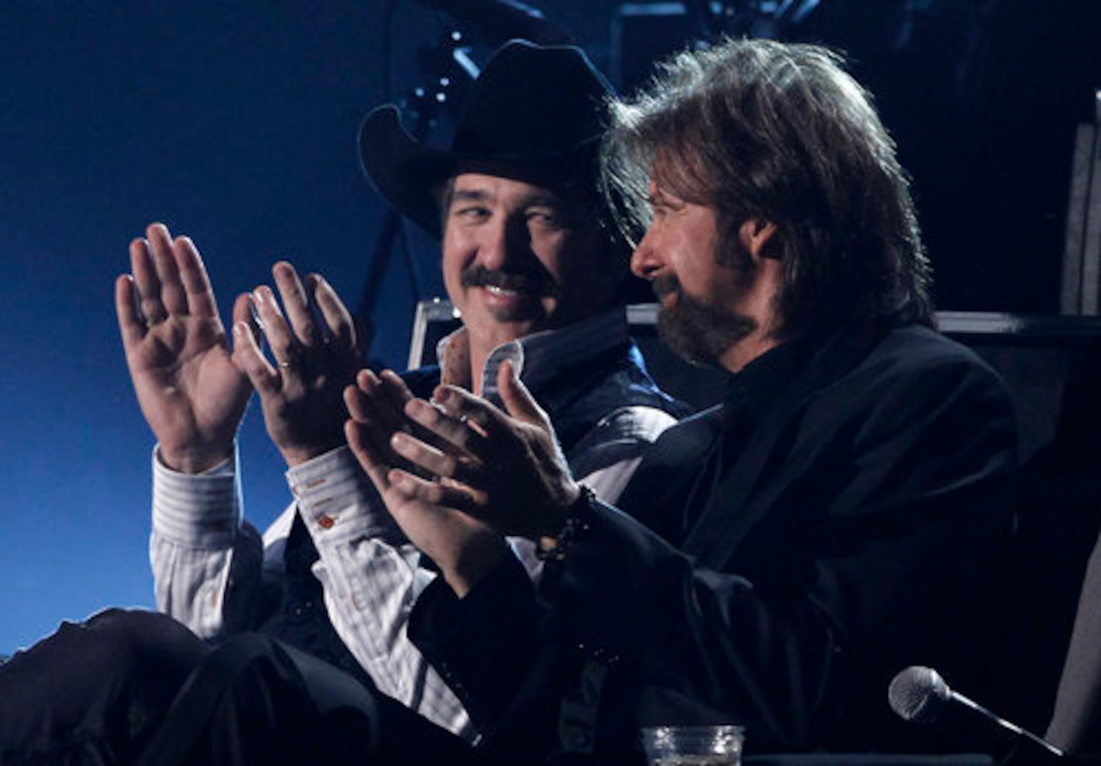 Kix Brooks and Ronnie Dunn applaud one of the performances.