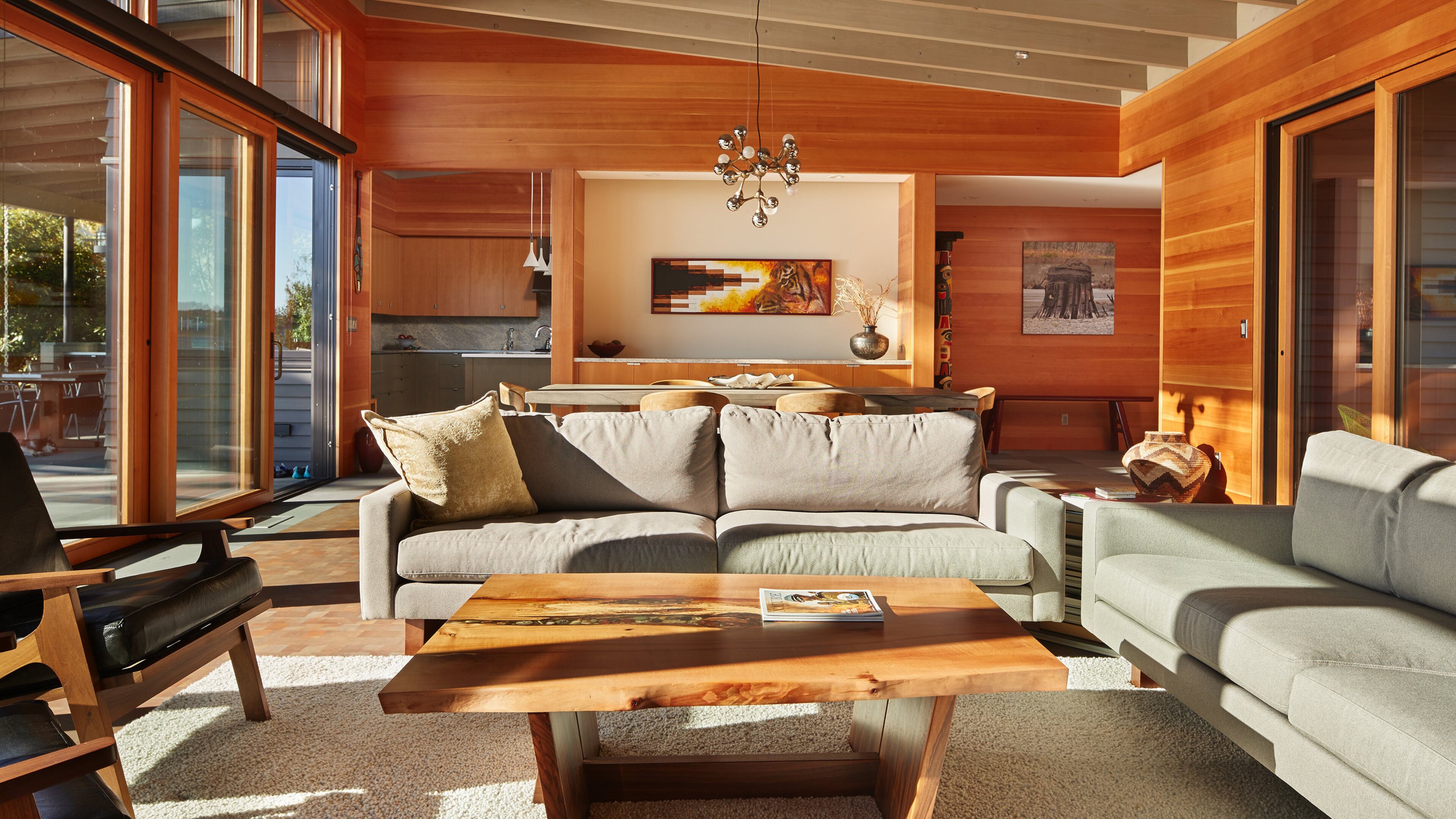 The dining/living area anchors the public space, with a more-private wing at one end for the master suite, a secondary wing on the other end with the garage and guest room/den, and the kitchen in the corner. “This is a very low-profile house and quiet design,” architect Marc LaRoche says. “They wanted single-story living to grow old in.” (Benjamin Benschneider/The Seattle Times/TNS)