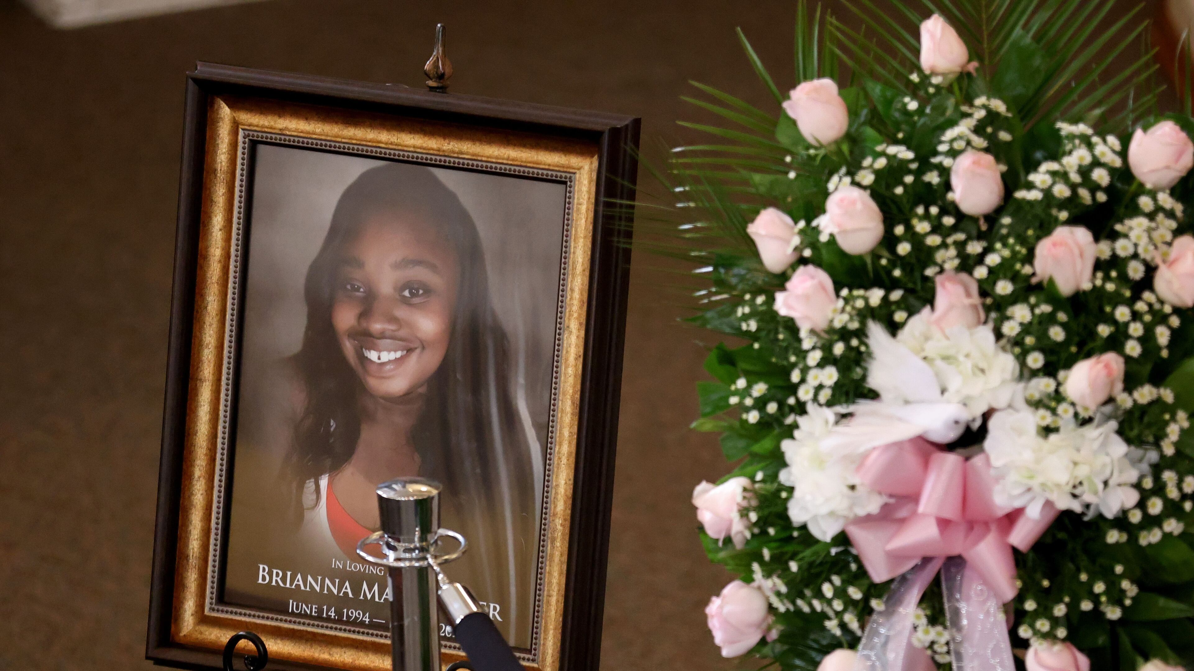 A photograph of Brianna Grier is shown at her funeral. The 28-year-old mother of twin girls died in July of last year after falling out of a moving police car, authorities said. (Jason Getz/The Atlanta Journal-Constitution/TNS)