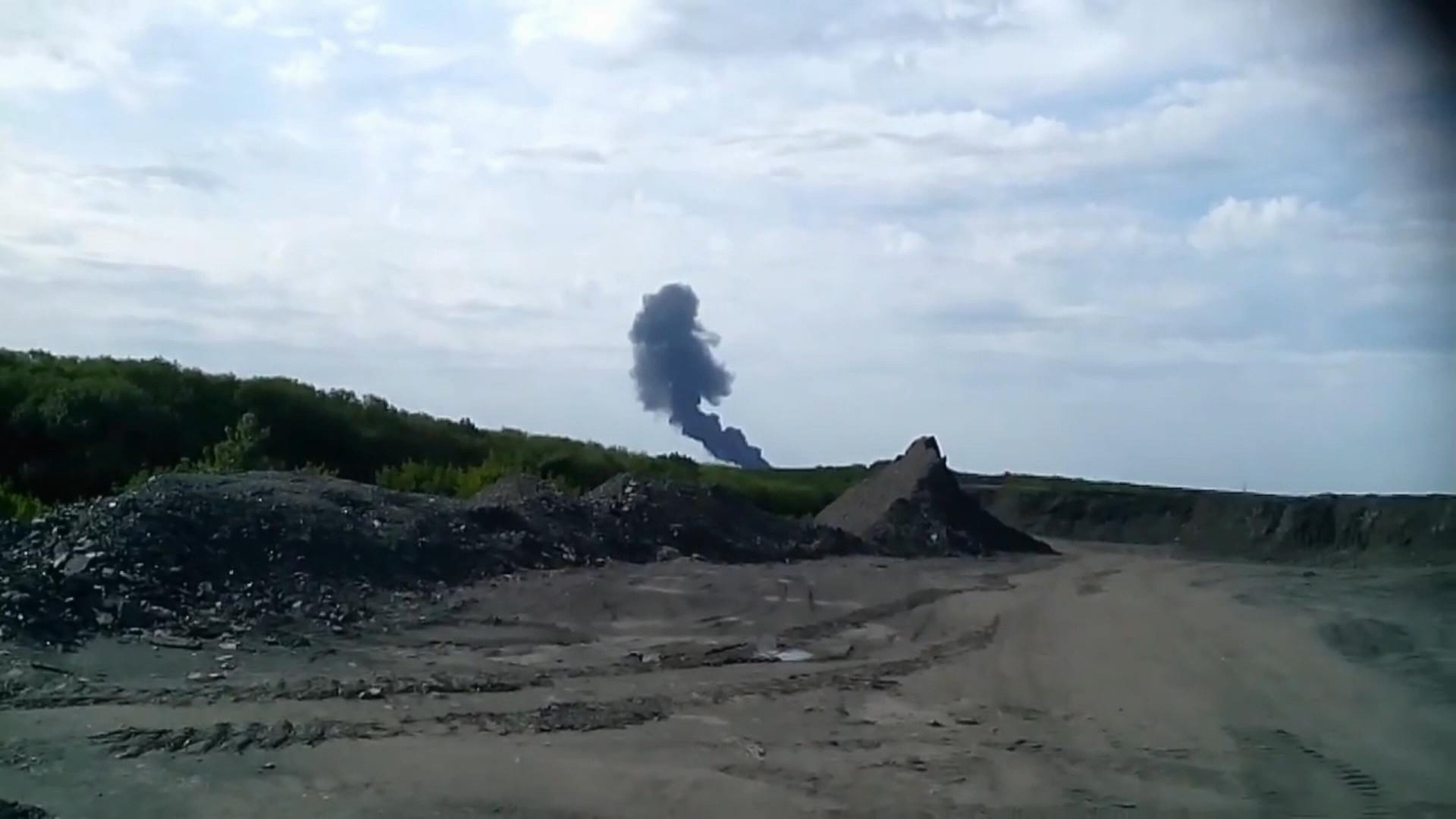 In this image taken from amateur video, Thursday July 17, 2014, Smoke rises from a fireball is seen in the distance shortly after a Malaysia Airlines passenger plane carrying 295 people was shot down Thursday as it flew over Ukraine, and plumes of black smoke rose up from the scene near the rebel-held village of Grabovo, in eastern Ukraine. Malaysia Airlines has tweeted that it lost contact with one of its flights as it was traveling from Amsterdam to Kuala Lumpur over Ukrainian airspace. (AP Photo / Amateur Video accessed by APTV)