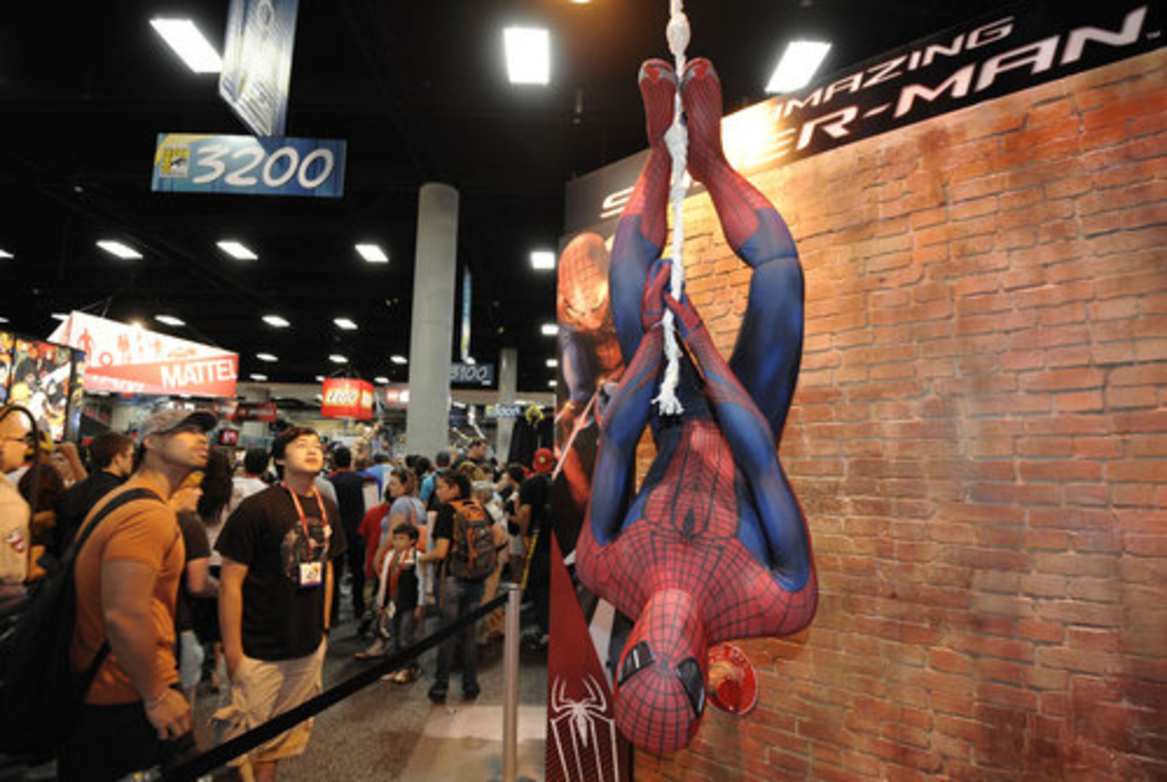 HE WAS JUST HANGING OUT: Fans get a look at an Amazing Spider-Man exhibit on the last day of the Comic-Con International 2011 convention held in San Diego Sunday, July 24, 2011.