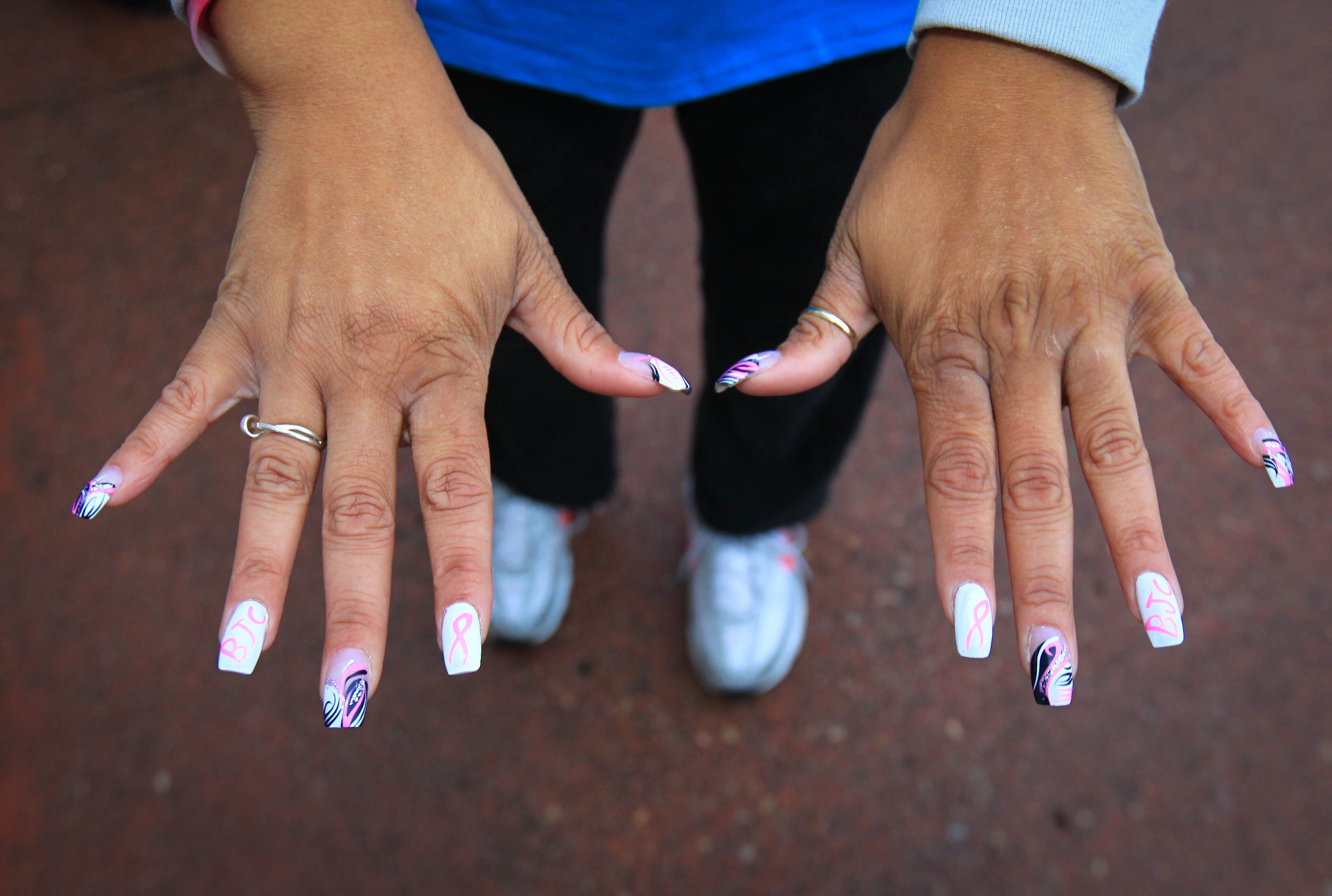 Nails that have been painted to support Breast Cancer Awareness at the Making Strides Against Breast Cancer Walk in Dayton at Fifth Third Field Saturday morning. JIM WITMER / STAFF