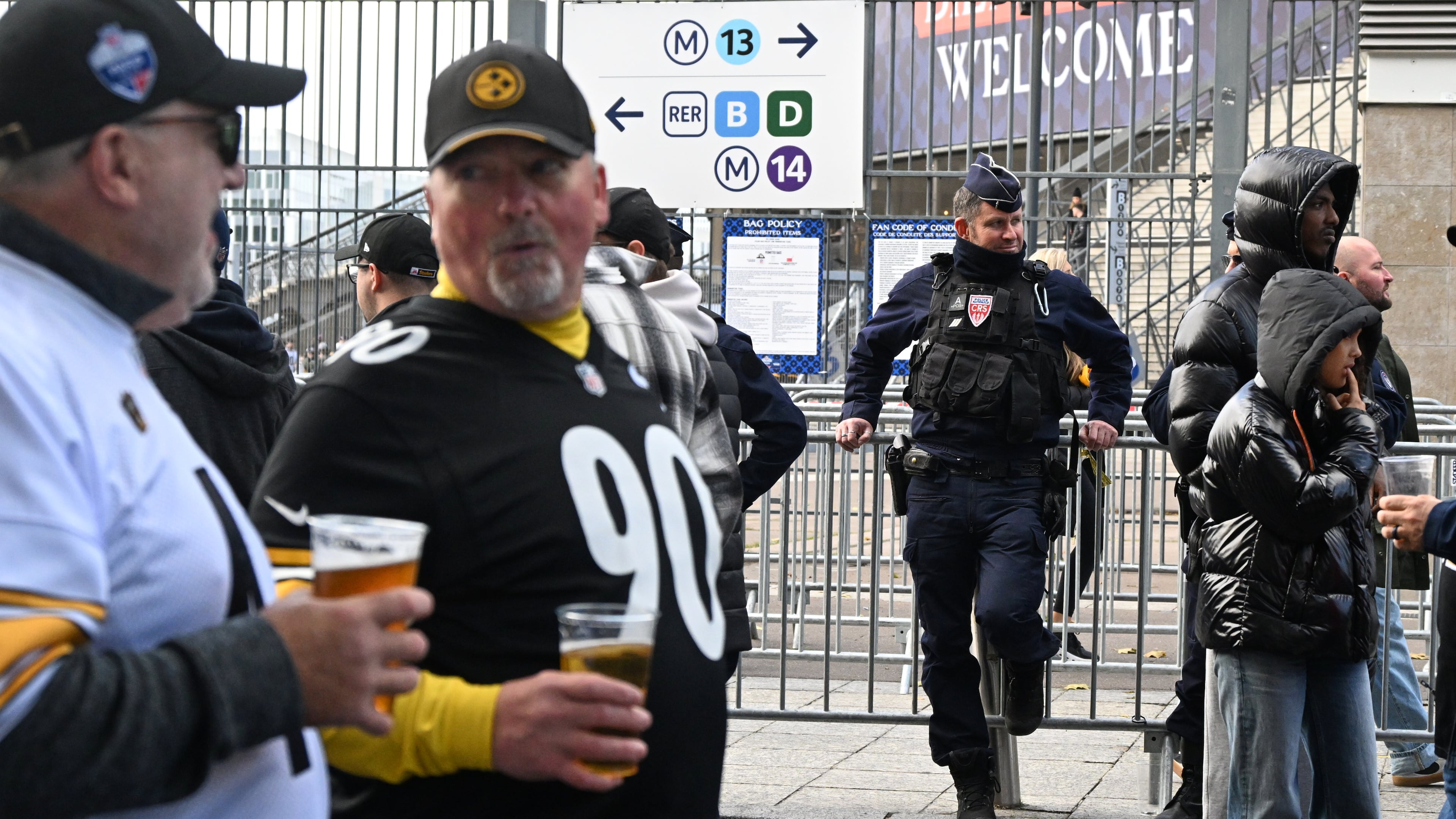 A police officer stands outside the Stade de France stadium before the start of the NFL football game between Pittsburgh Steelers and New Orleans Saints in Saint-Denis, outside Paris, Sunday, Oct. 25, 2026. (AP Photo/Emma Da Silva)
