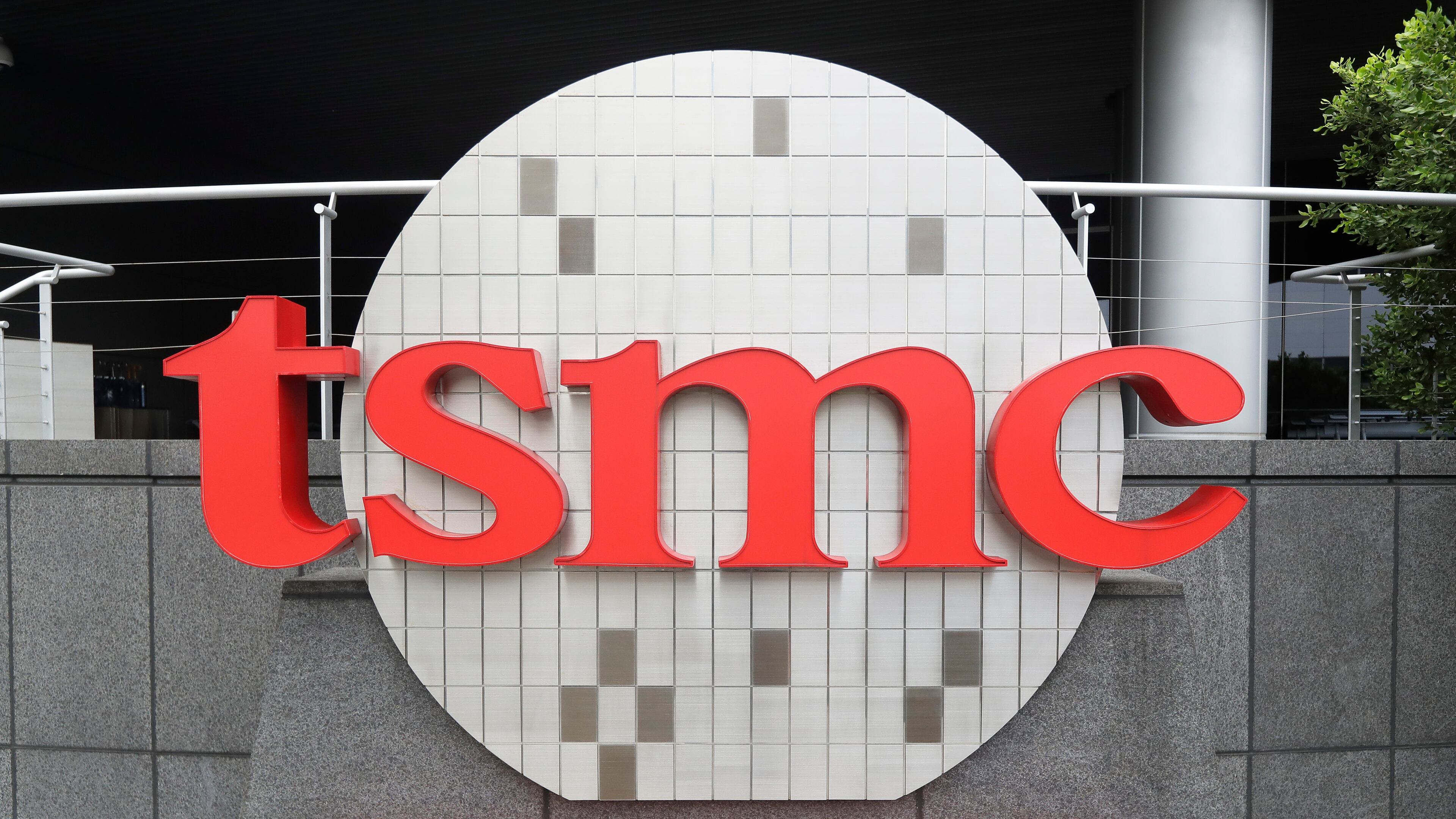 FILE - A Taiwan Semiconductor Manufacturing Co., Ltd. (TSMC) logo is seen at the headquarters in Hsinchu, Taiwan, Oct. 20, 2021. (AP Photo/Chiang Ying-ying, File)